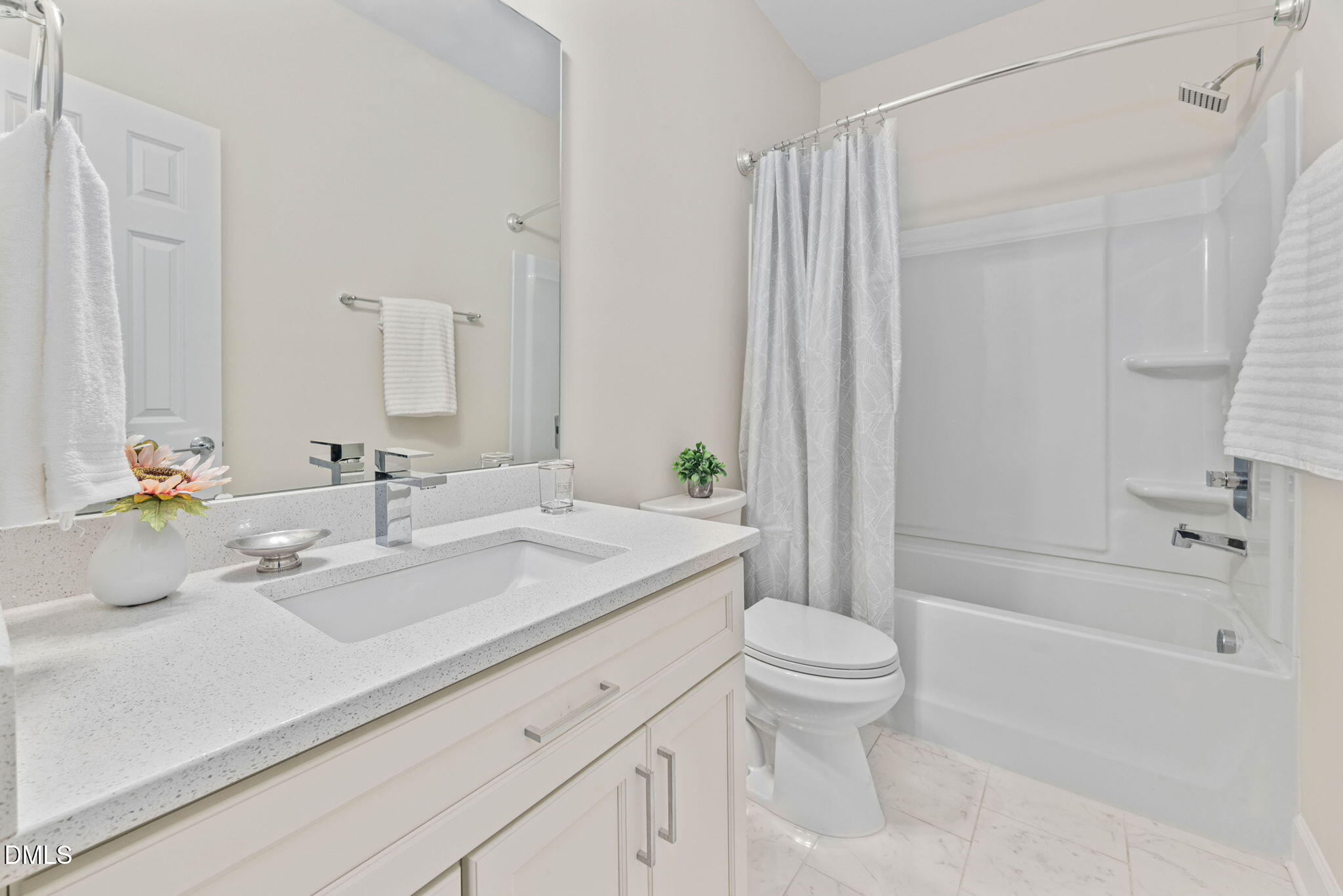 1106 South Blount Street Raleigh, NC 27601 - Photo 13 of 33 a bathroom with a sink a toilet and shower