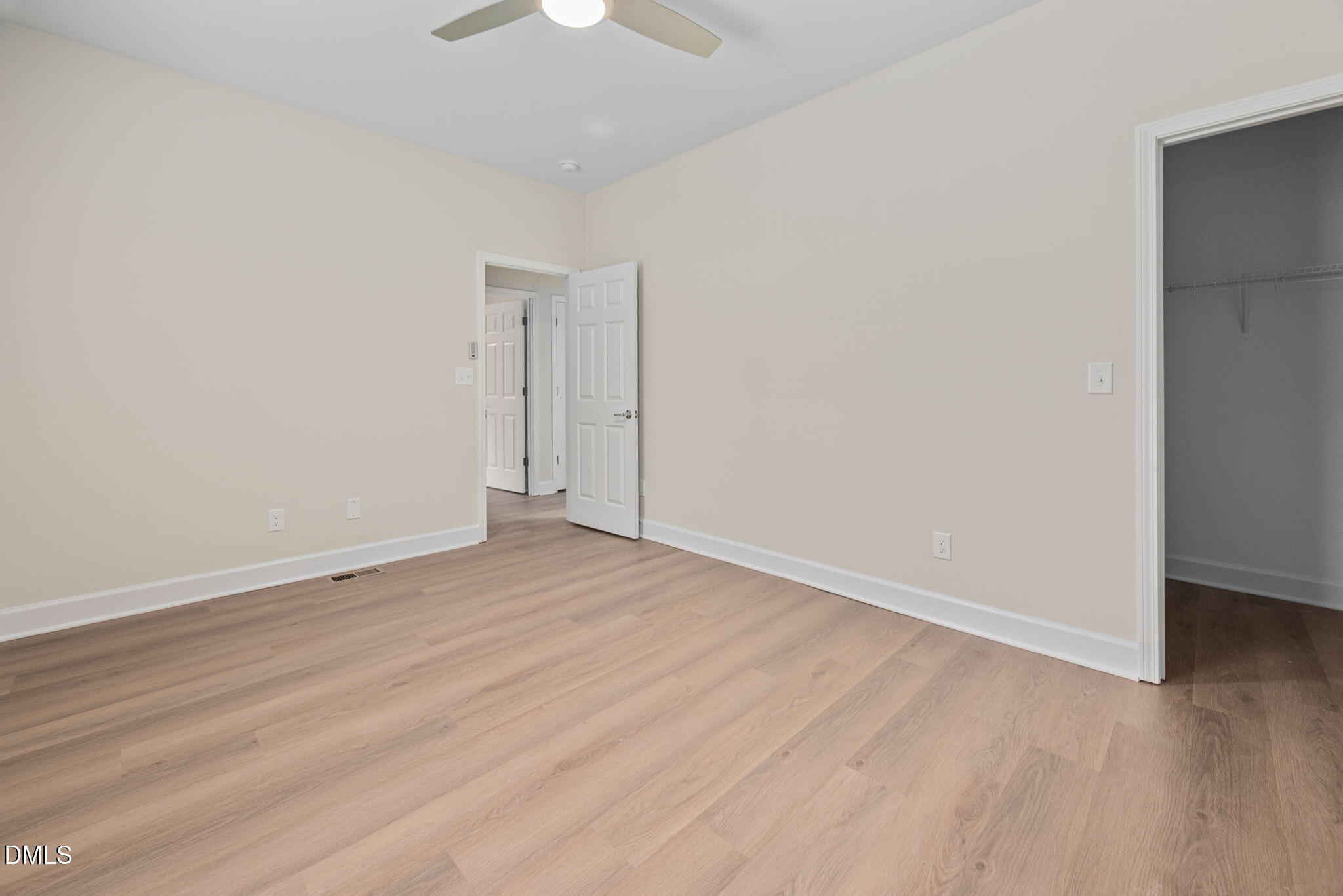 1106 South Blount Street Raleigh, NC 27601 - Photo 15 of 33 a view of an empty room with wooden floor