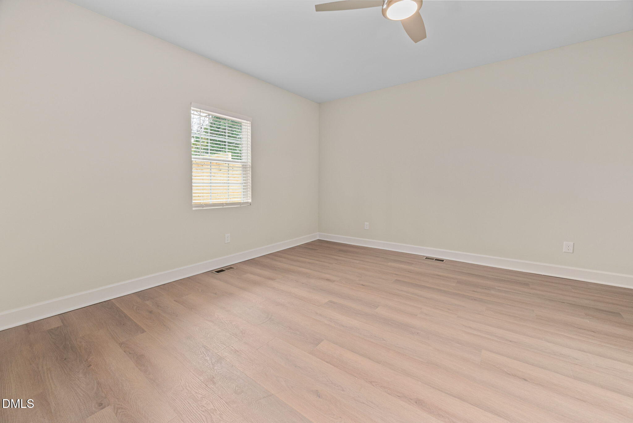 1106 South Blount Street Raleigh, NC 27601 - Photo 16 of 33 an empty room with wooden floor and windows