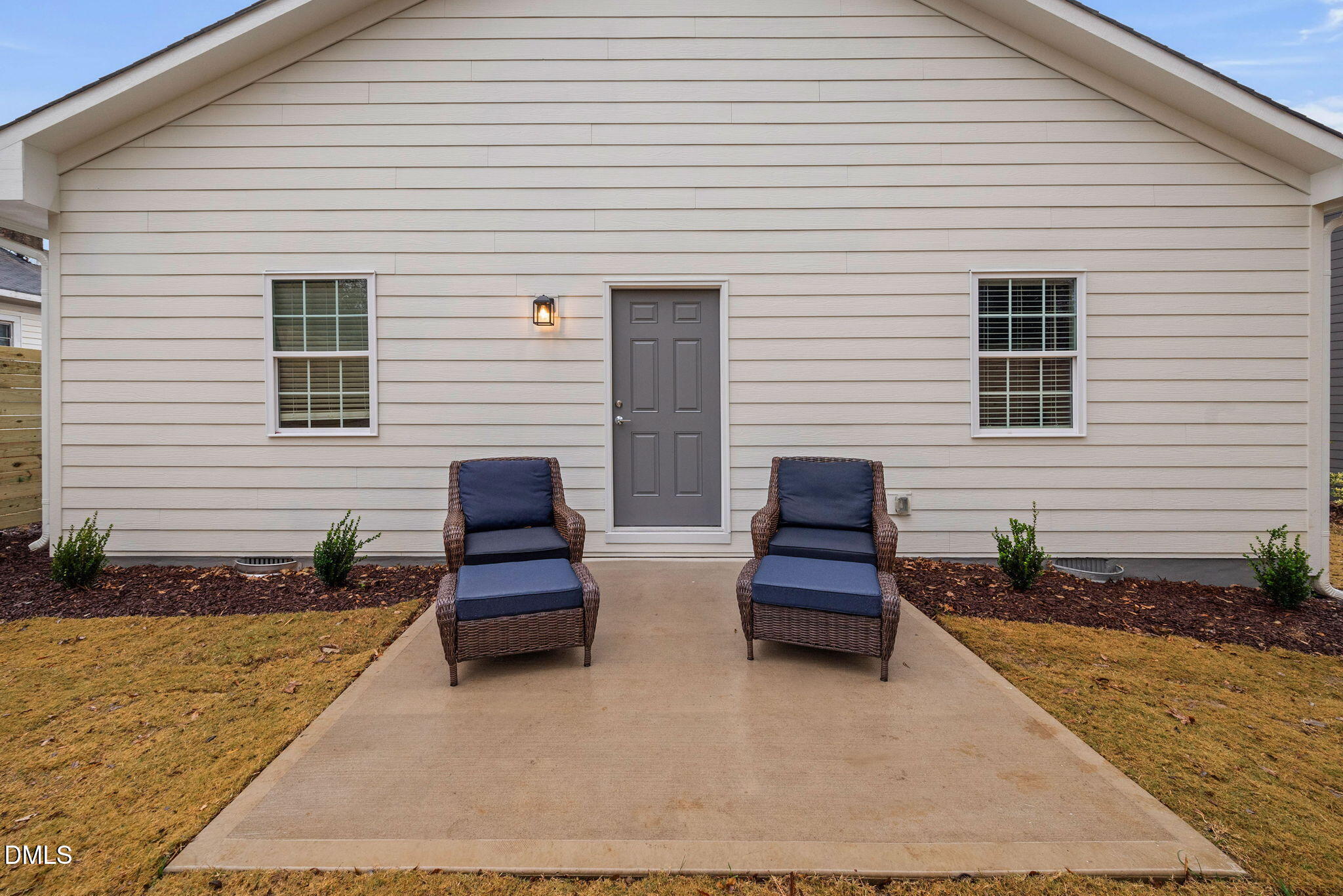1106 South Blount Street Raleigh, NC 27601 - Photo 20 of 33 a view of a house with a barbeque and wooden chair