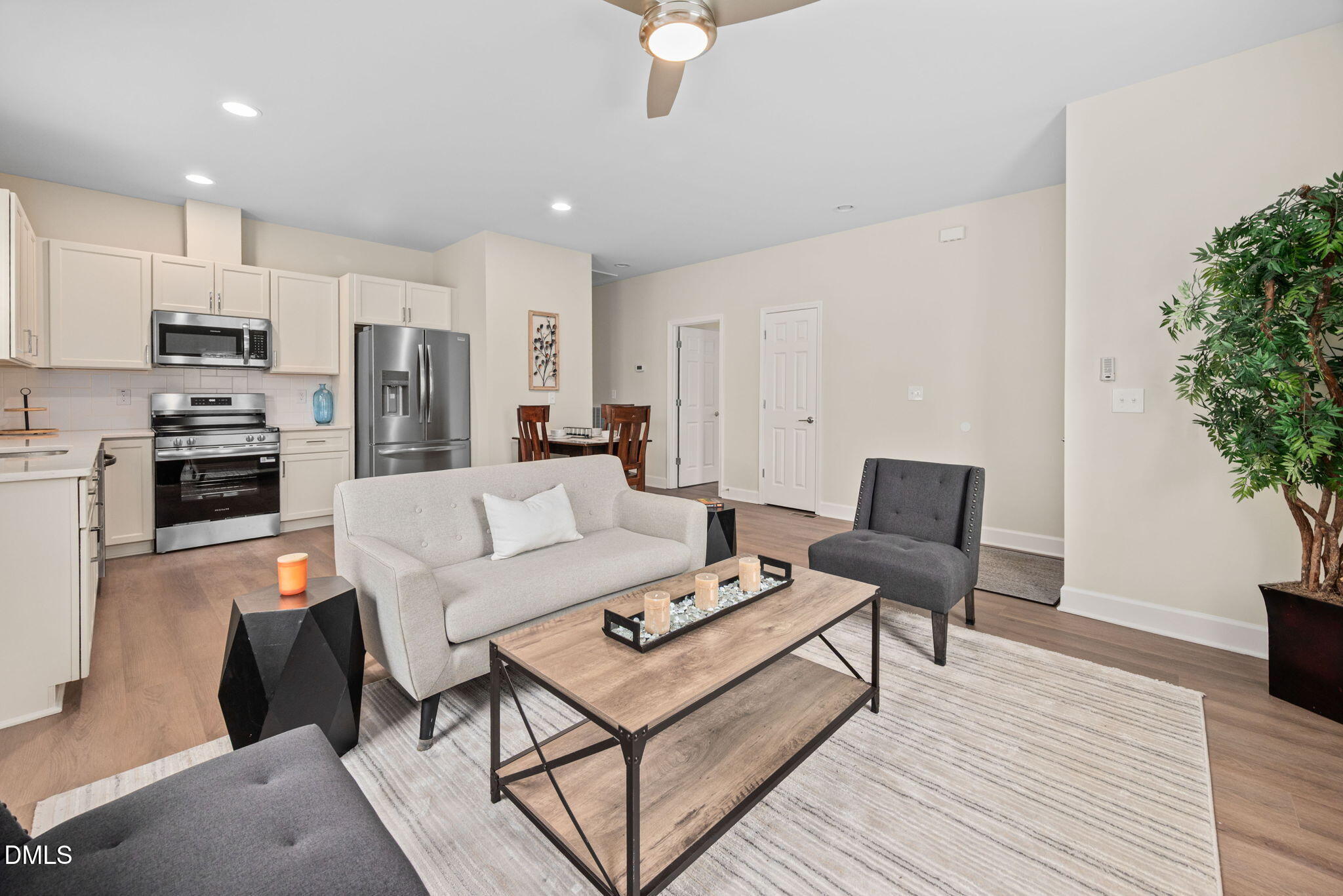 1106 South Blount Street Raleigh, NC 27601 - Photo 4 of 33 a living room with furniture kitchen and a potted plant