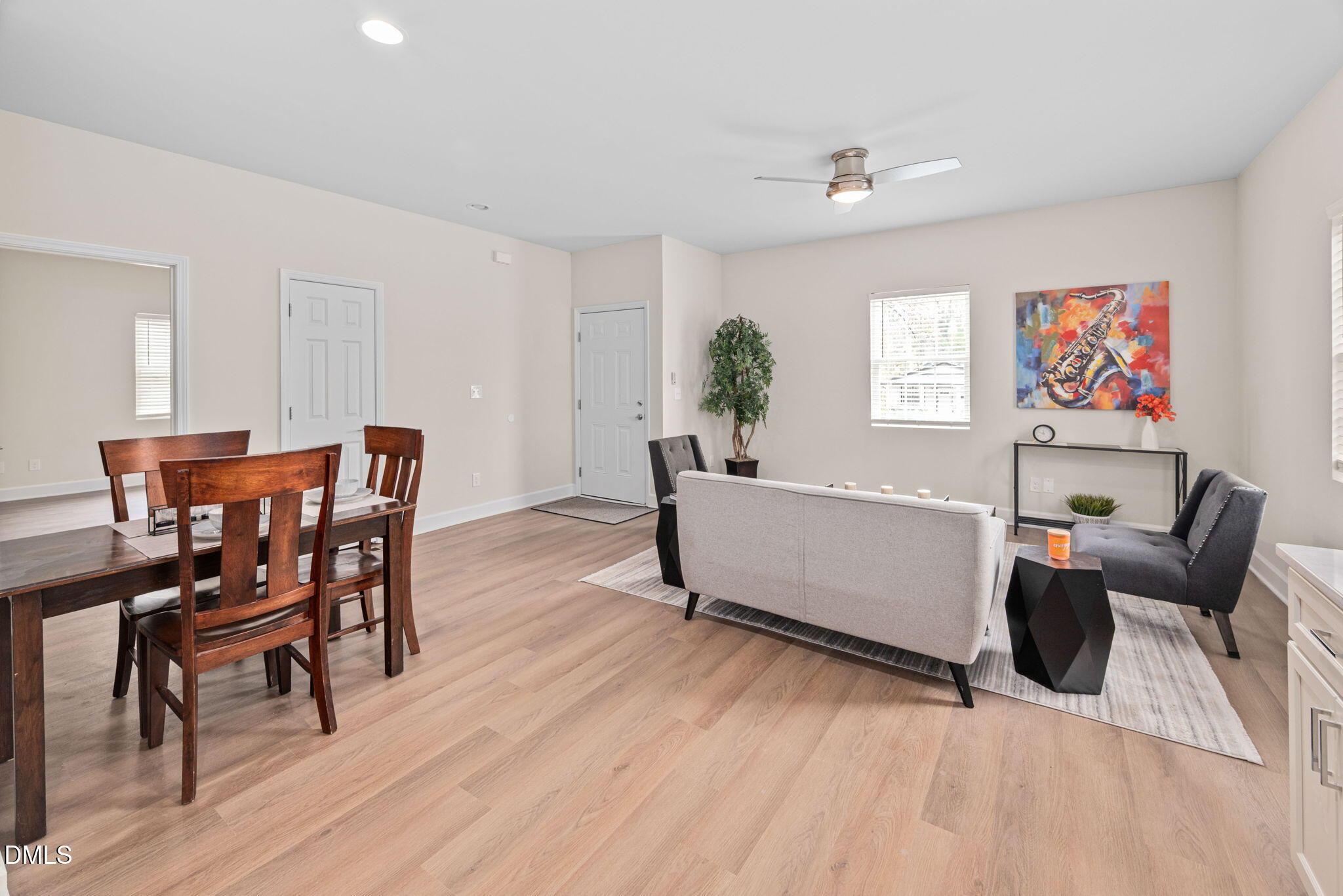 1106 South Blount Street Raleigh, NC 27601 - Photo 5 of 33 a living room with furniture and a wooden floor