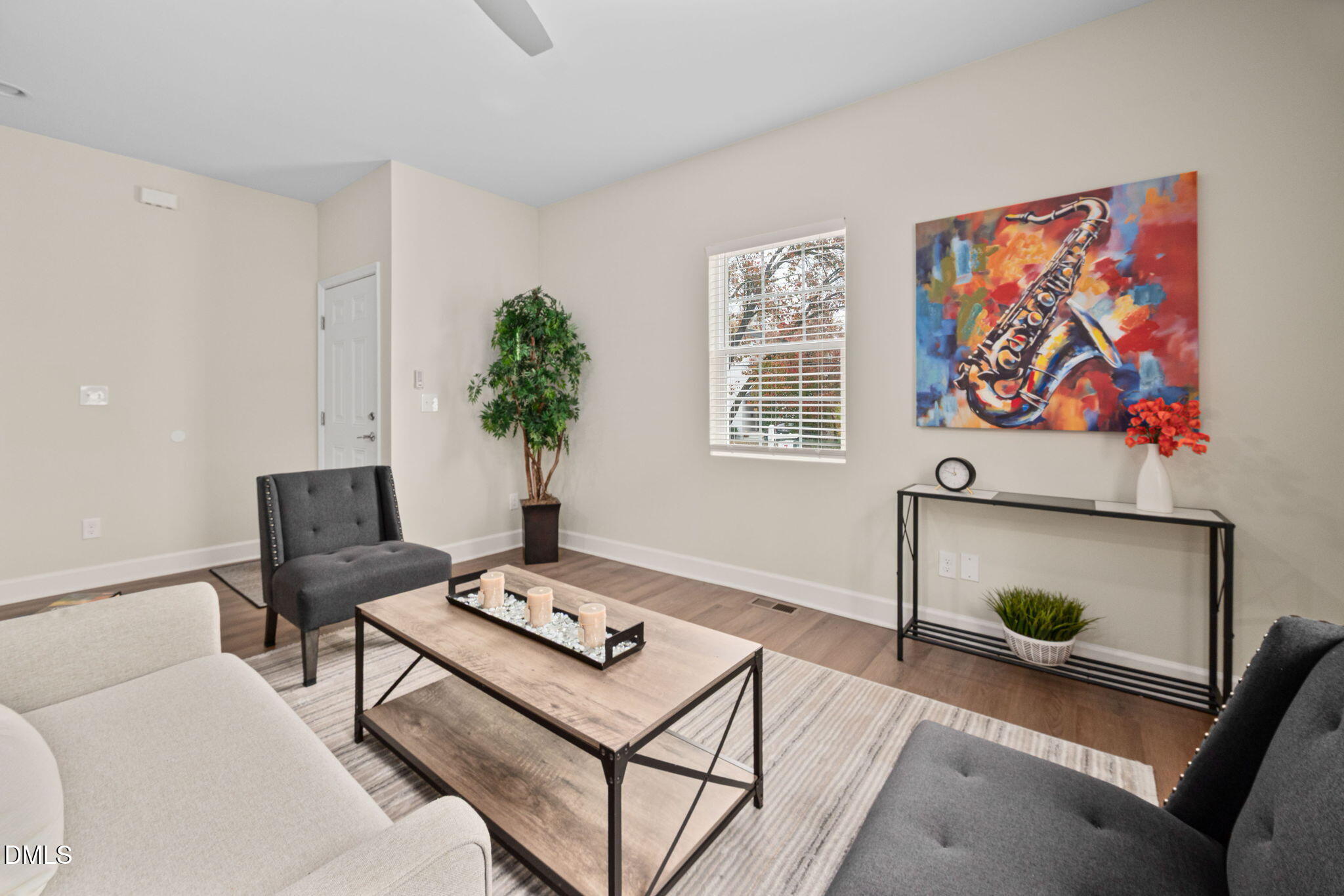 1106 South Blount Street Raleigh, NC 27601 - Photo 8 of 33 a living room with furniture and a flat screen tv