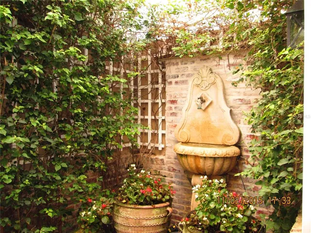 a bathroom with a toilet and a shower curtain