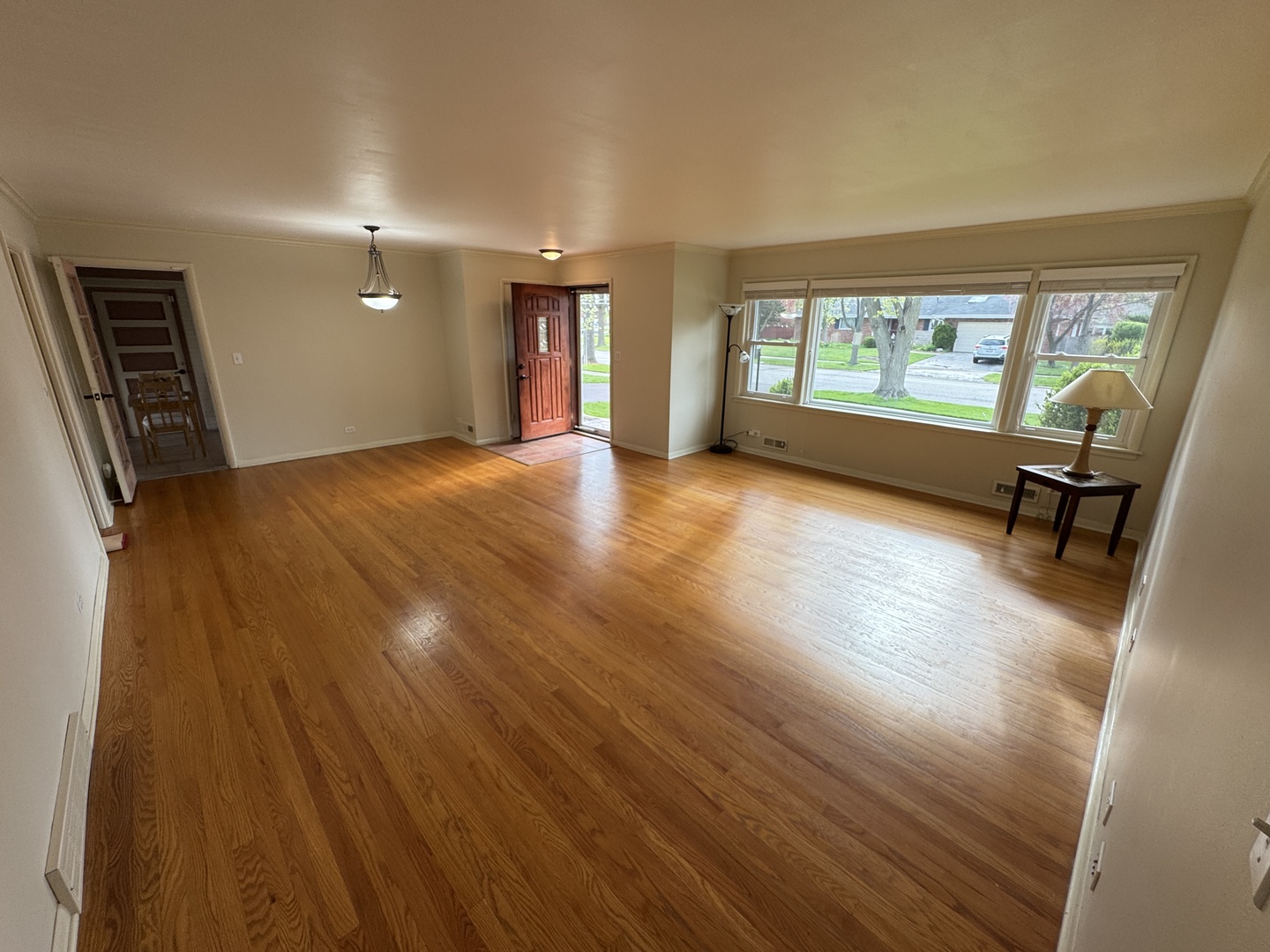 901 Brookline Lane Park Ridge, IL 60068 - Photo 2 of 23 wooden floor in an empty room with a window