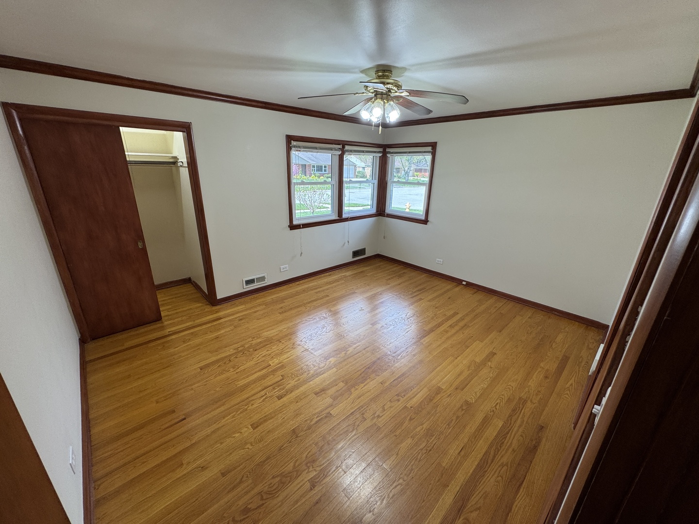 901 Brookline Lane Park Ridge, IL 60068 - Photo 5 of 23 a view of an empty room with wooden floor and a window