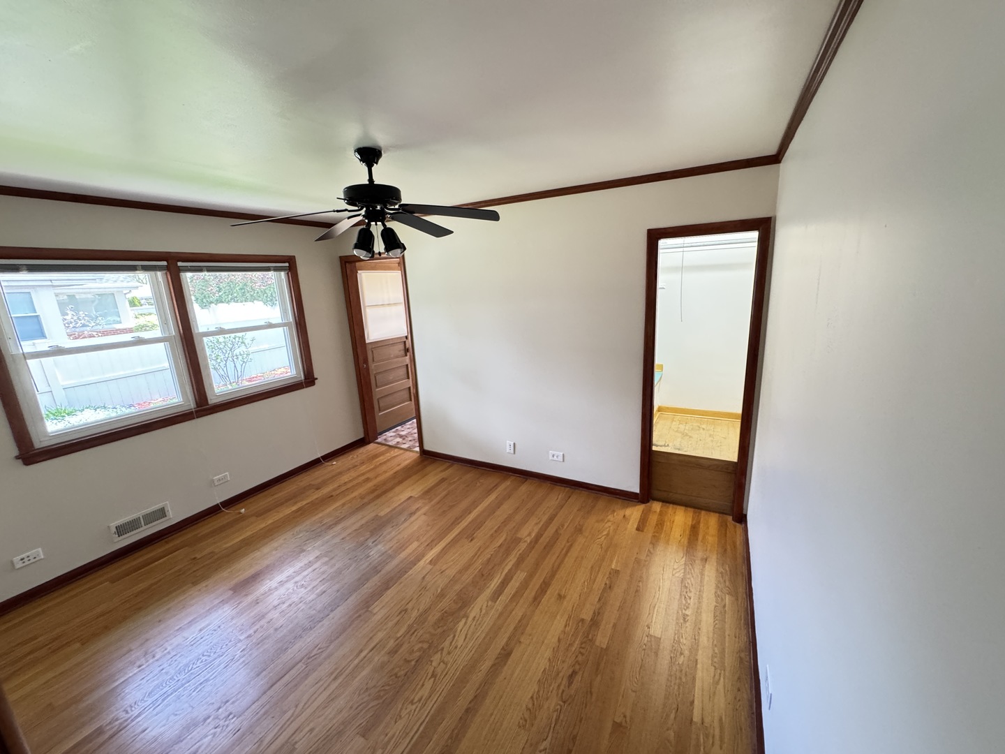 901 Brookline Lane Park Ridge, IL 60068 - Photo 9 of 23 a view of empty room with wooden floor and fan