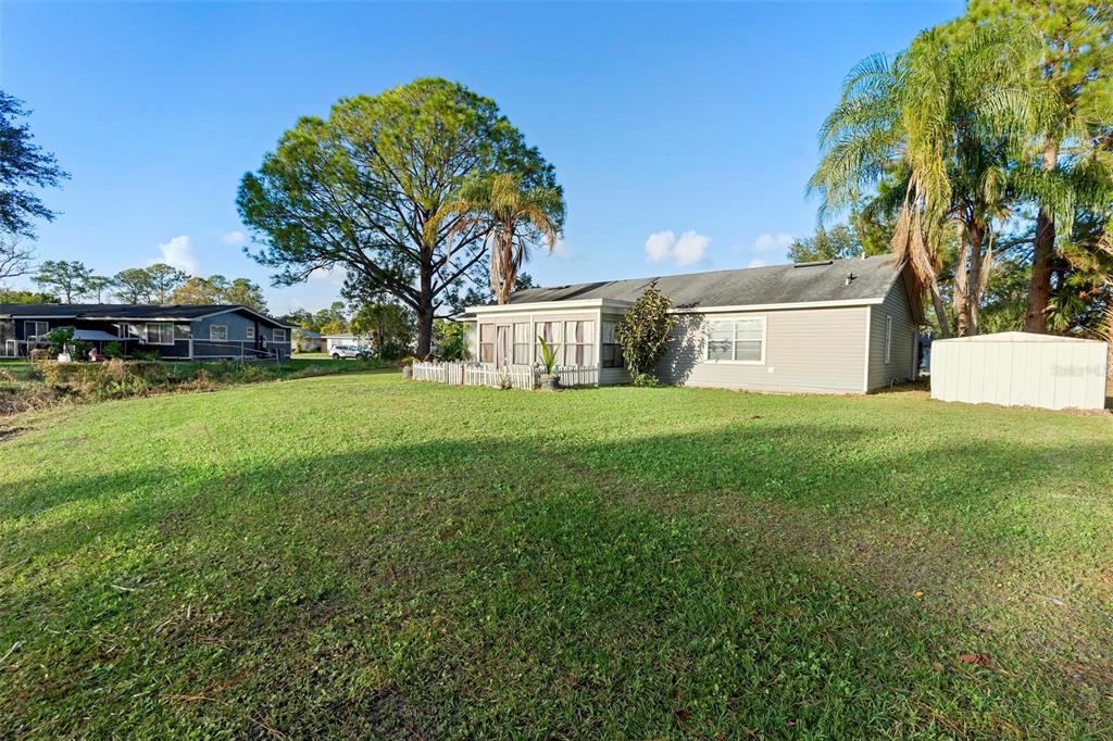 2573 Delaware Road Deltona, FL 32738 - Photo 27 of 31 backyard view of home facing rear