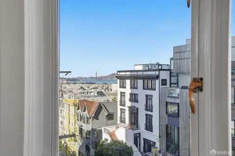 a view of buildings from the balcony