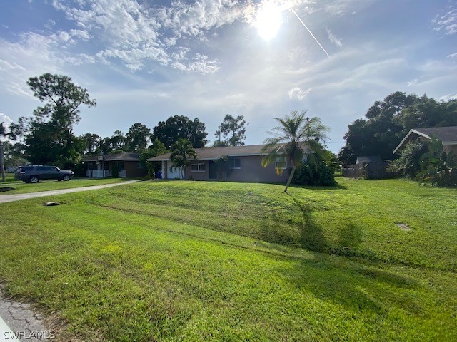 18688 Sebring Road Fort Myers, FL 33967 - Photo 3 of 20 a view of a golf course with a lake