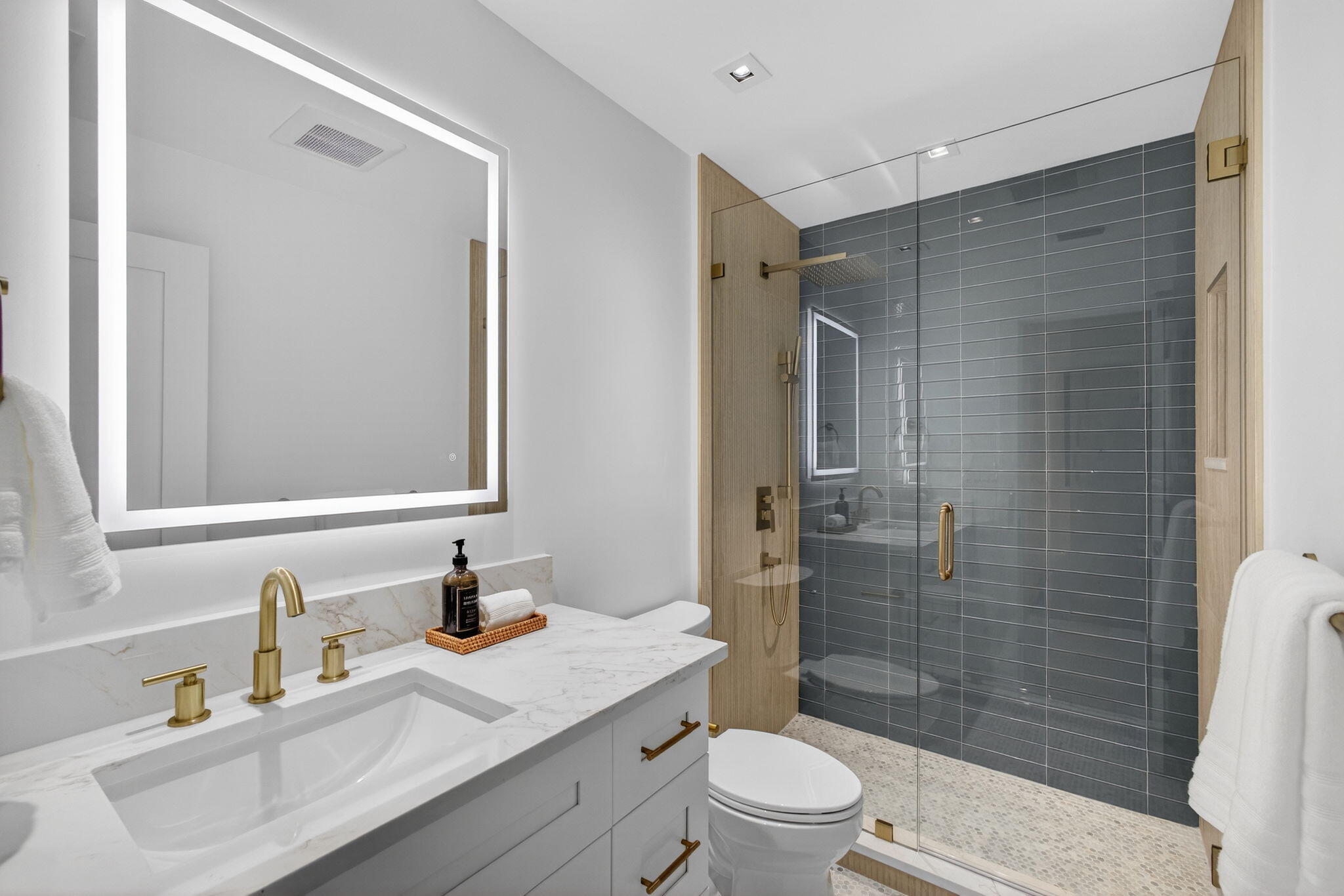 6550 North Ocean Boulevard, Unit 1 Ocean Ridge, FL 33435 - Photo 37 of 63 a bathroom with a sink toilet vanity and shower