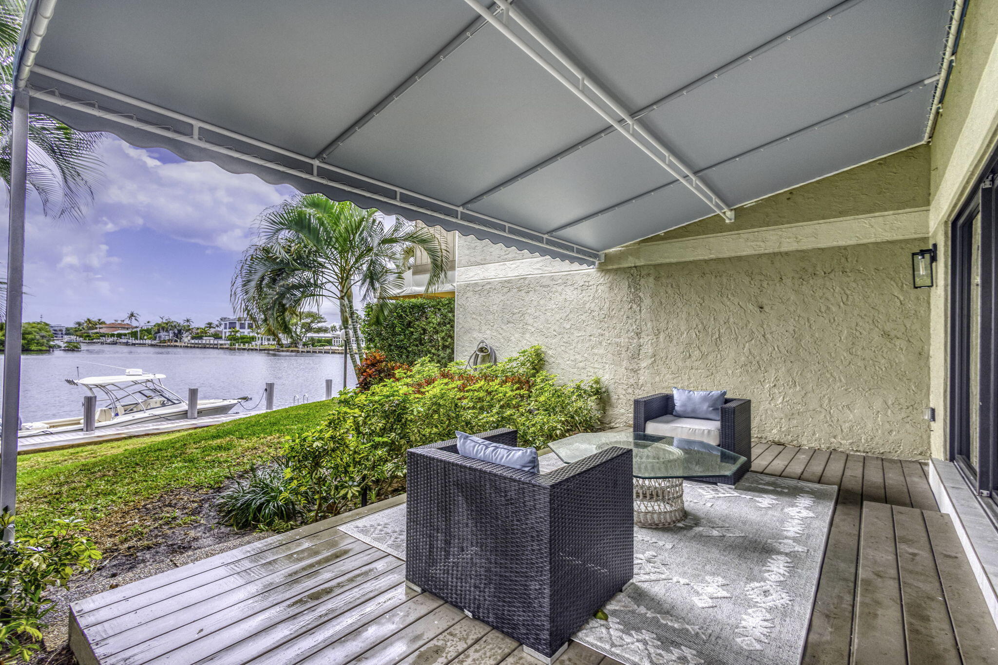 6550 North Ocean Boulevard, Unit 1 Ocean Ridge, FL 33435 - Photo 51 of 63 a view of a couches in patio of a house