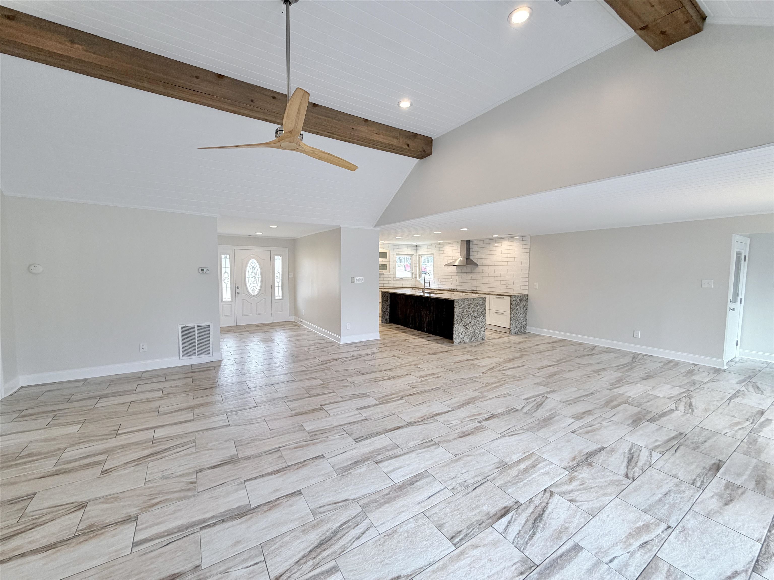 955 Country Club Road Somerville, TN 38068 - Photo 11 of 40 a view of empty room with wooden floor and fan