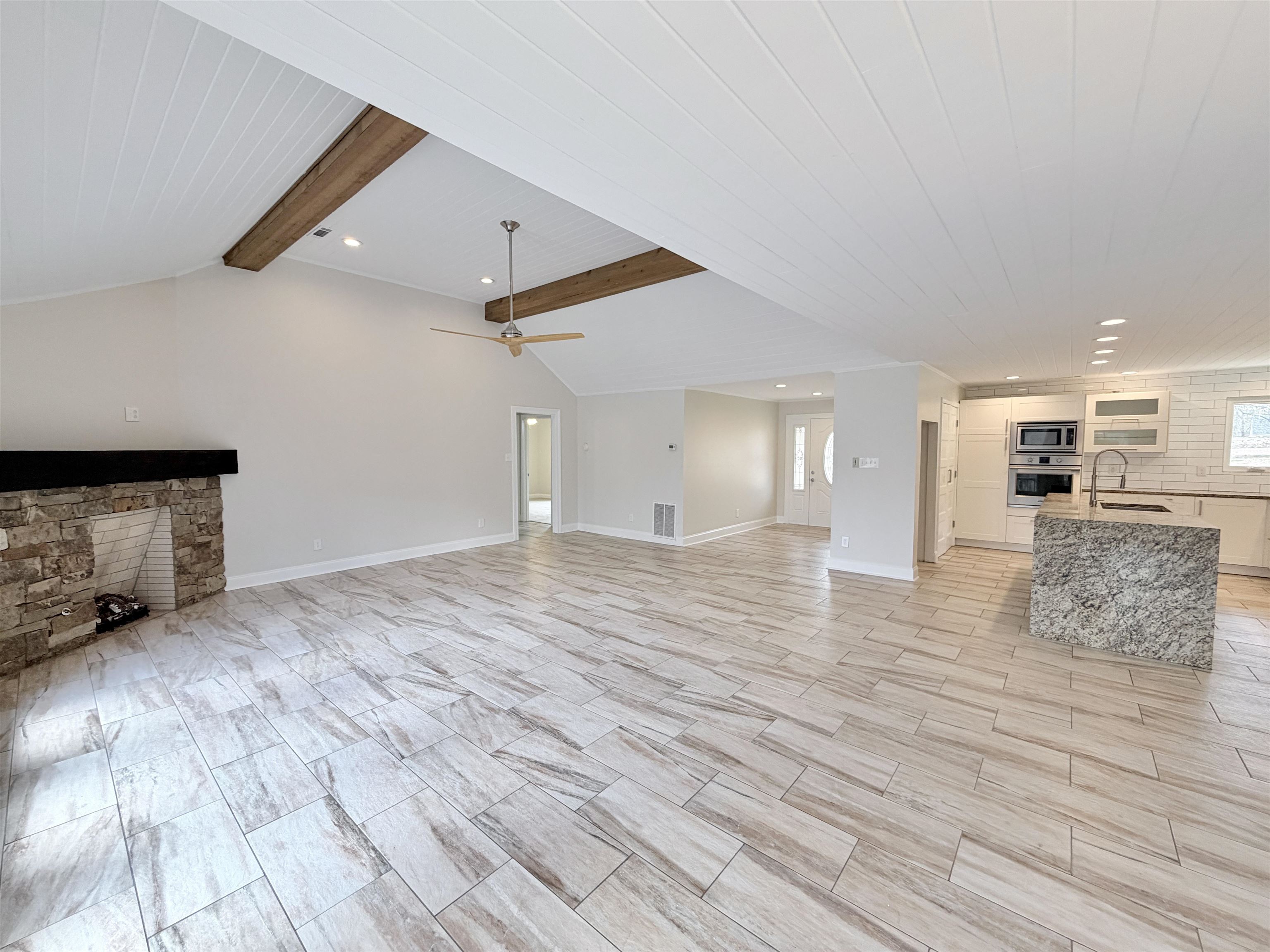 955 Country Club Road Somerville, TN 38068 - Photo 12 of 40 a view of a livingroom with wooden floor and staircase
