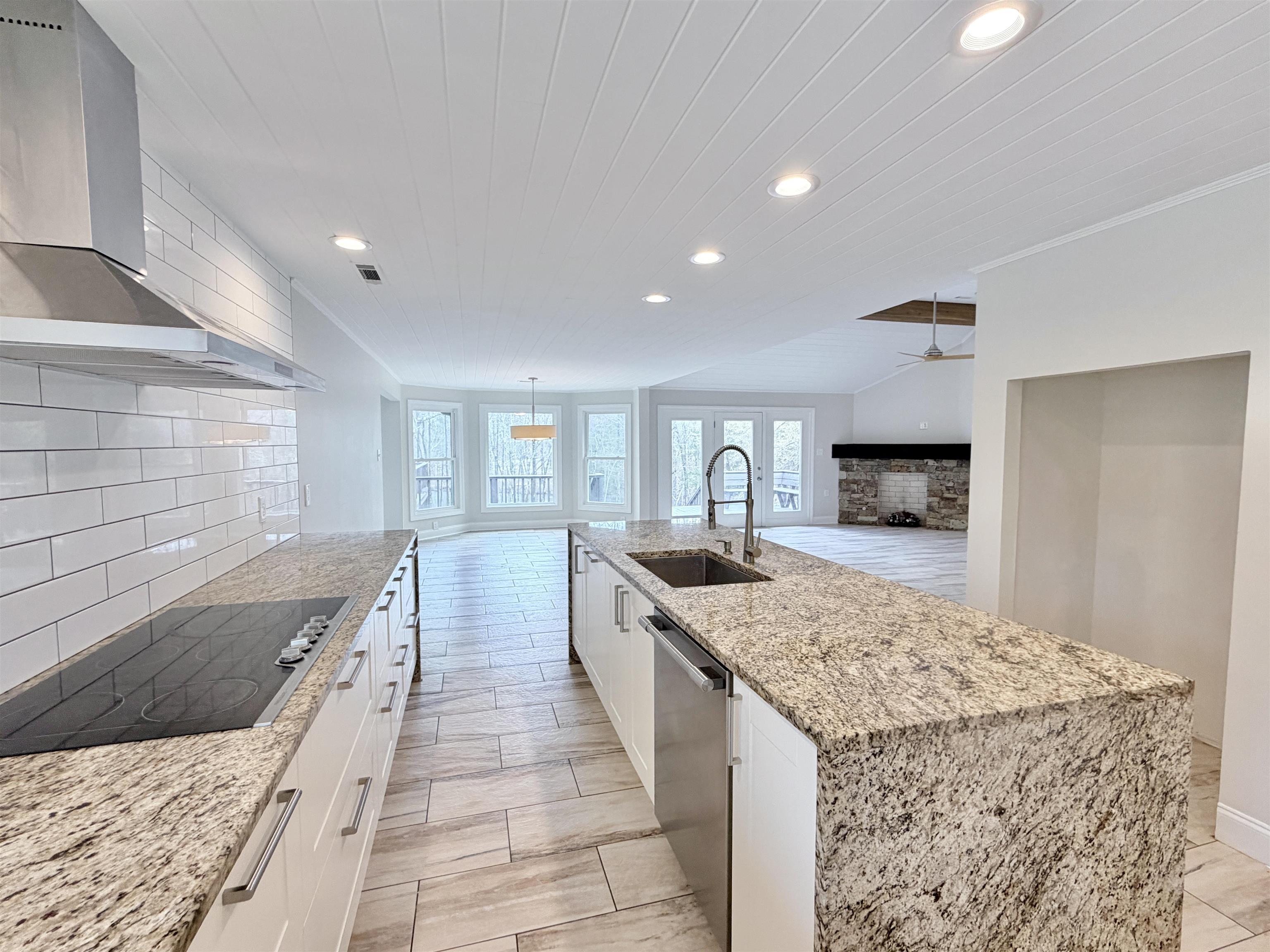 955 Country Club Road Somerville, TN 38068 - Photo 40 of 40 a large kitchen with kitchen island a sink stainless steel appliances and cabinets