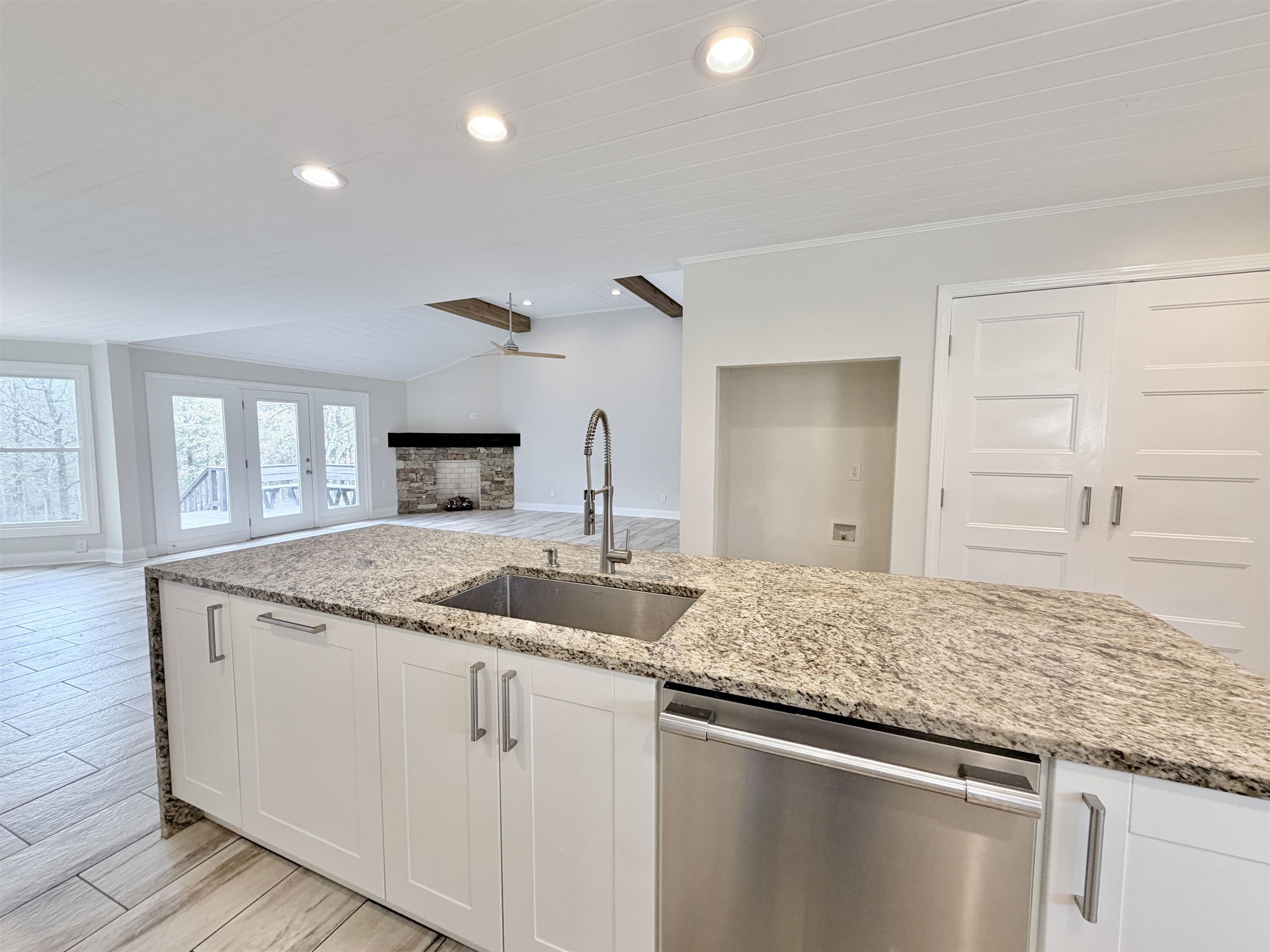 955 Country Club Road Somerville, TN 38068 - Photo 16 of 40 Kitchen featuring dishwasher, white cabinets, wood tiled floors, light stone counters, and recessed lighting
