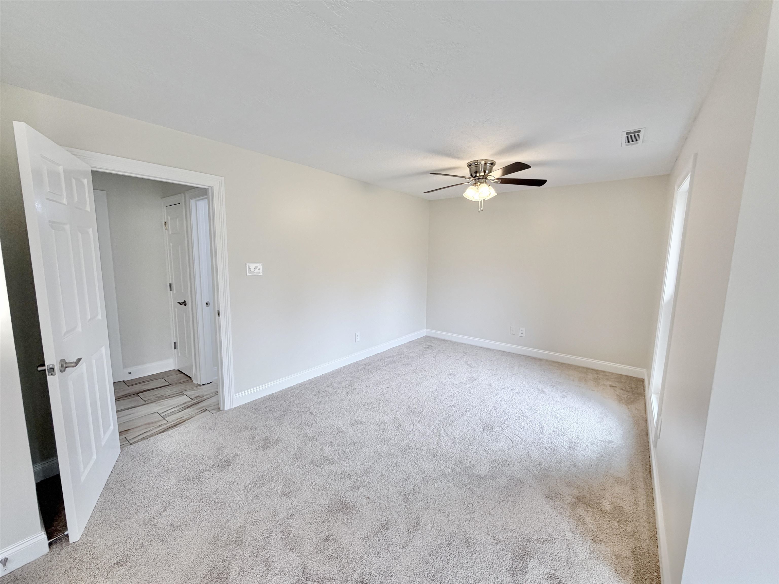 955 Country Club Road Somerville, TN 38068 - Photo 30 of 40 Empty room with light carpet and a ceiling fan