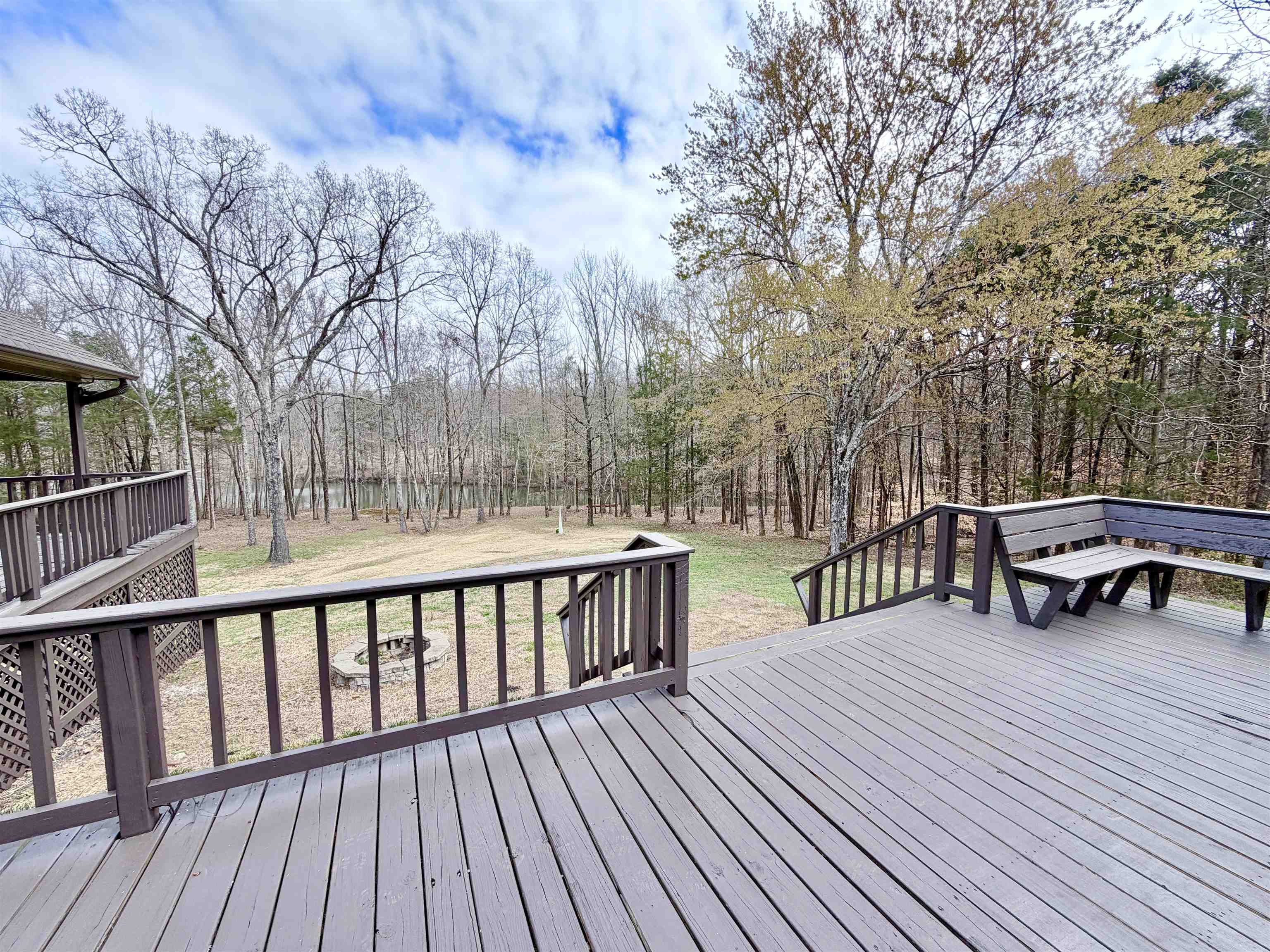 955 Country Club Road Somerville, TN 38068 - Photo 5 of 40 a view of a deck with chairs and wooden floor