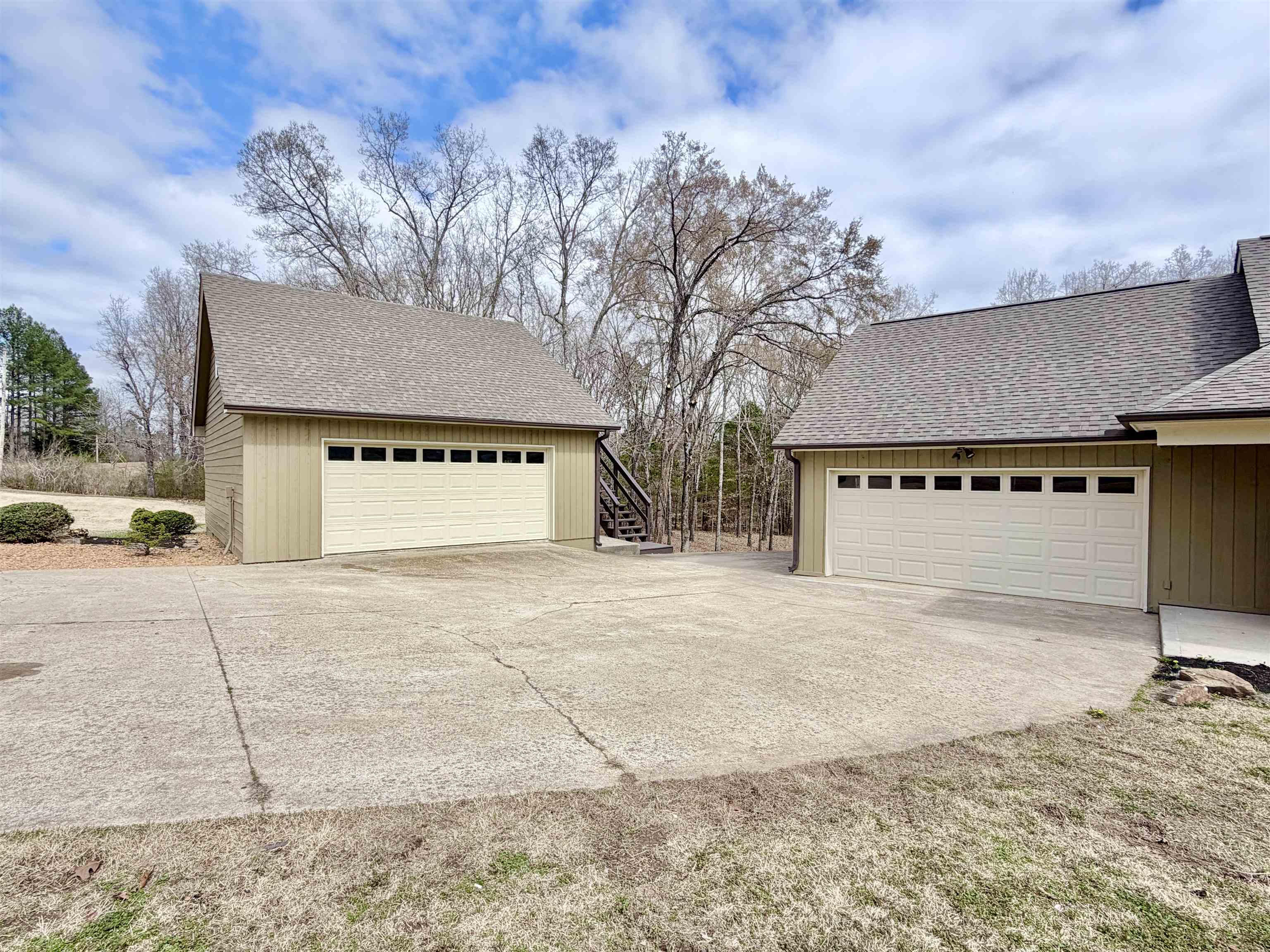 955 Country Club Road Somerville, TN 38068 - Photo 6 of 40 a view of a house with a yard and garage