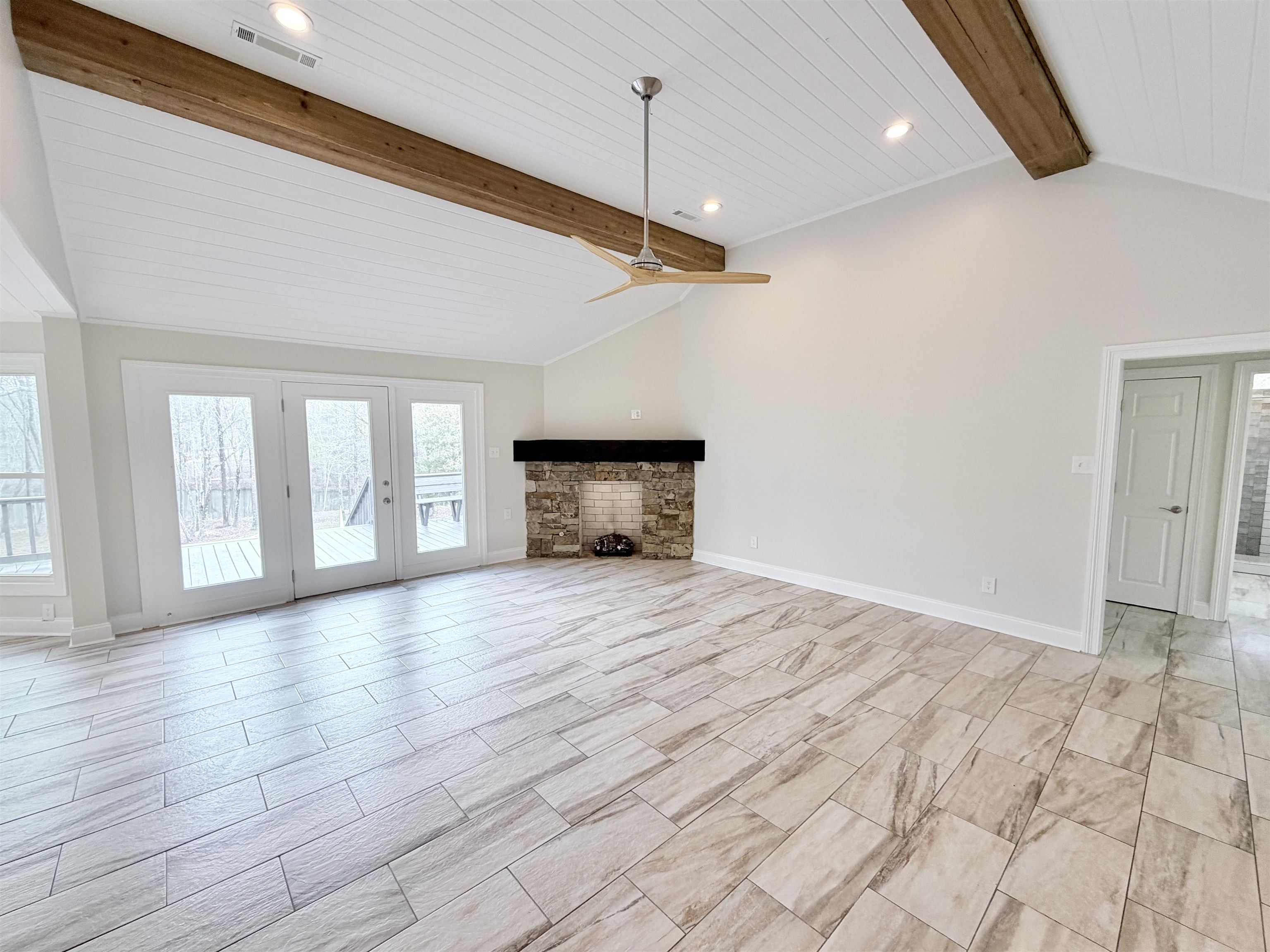 955 Country Club Road Somerville, TN 38068 - Photo 8 of 40 Unfurnished living room with a ceiling fan, recessed lighting, and a wood ceiling with exposed beams
