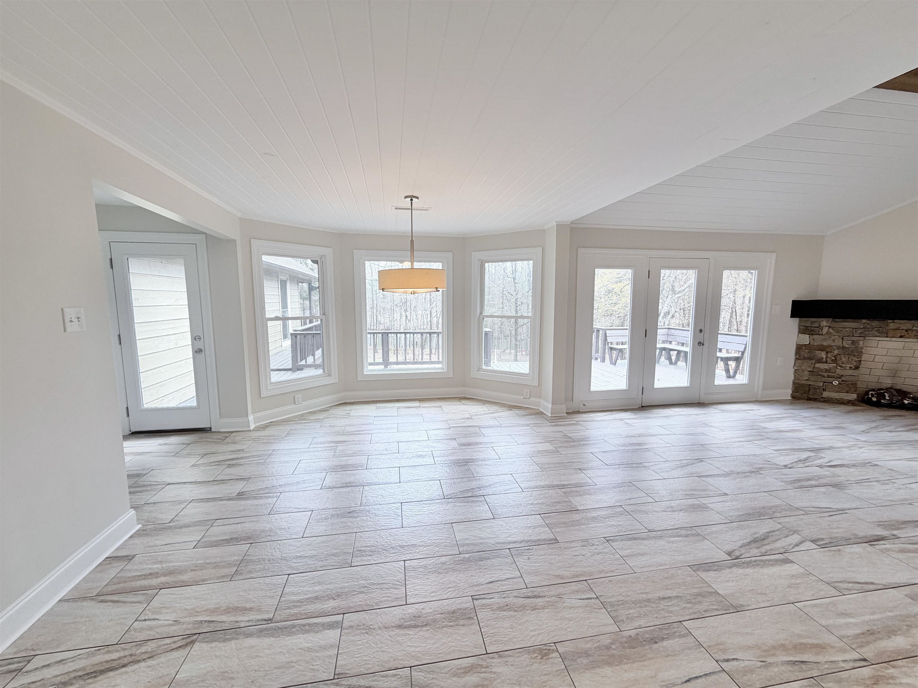 955 Country Club Road Somerville, TN 38068 - Photo 9 of 40 Unfurnished living room featuring wood ceiling and baseboards