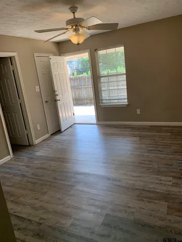 a view of entryway with wooden floor