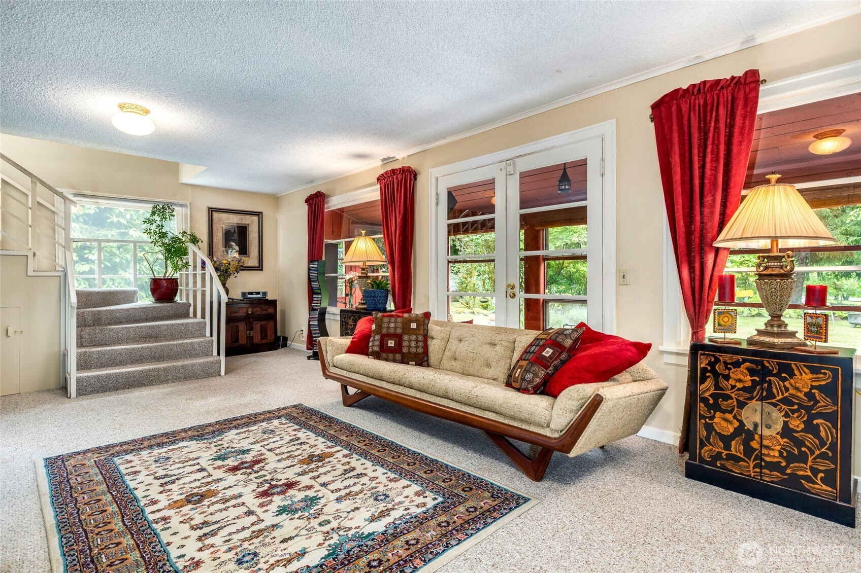 23606 Tiger Mountain Road Southeast Issaquah, WA 98027 - Photo 15 of 39 a living room with furniture and a large rug