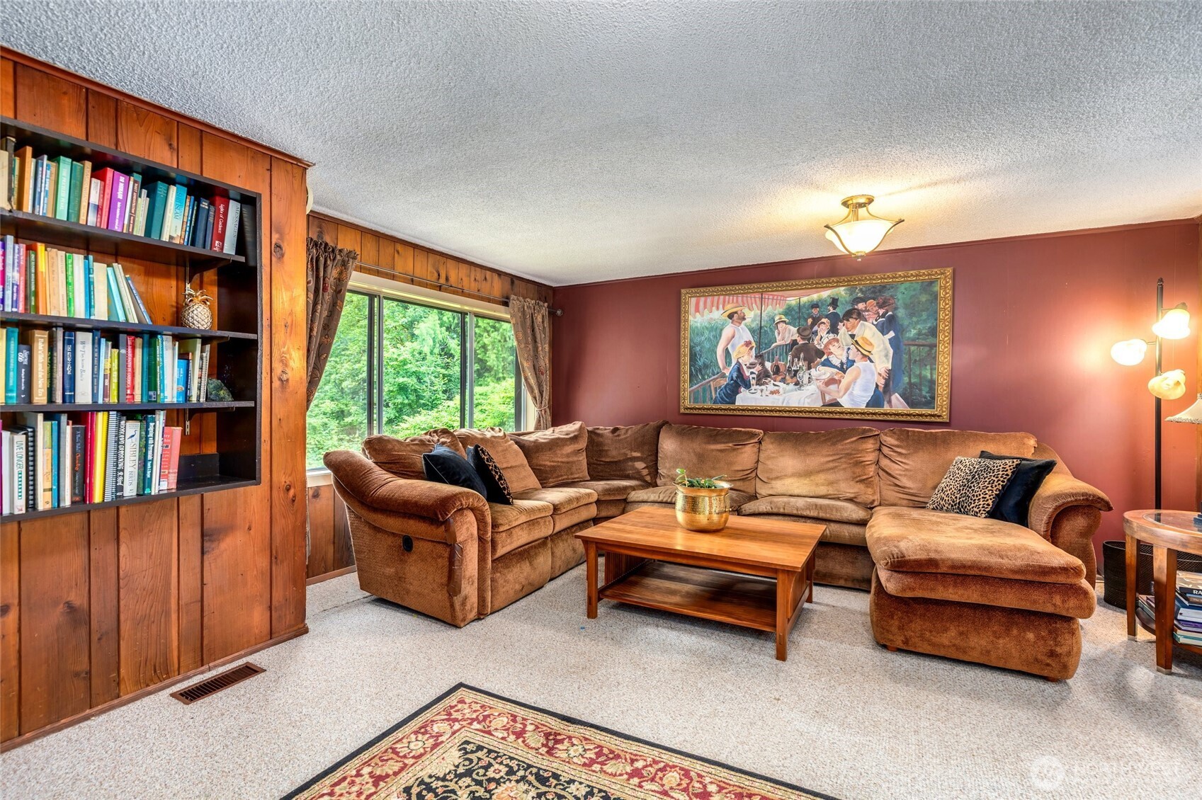 23606 Tiger Mountain Road Southeast Issaquah, WA 98027 - Photo 21 of 39 a living room with furniture and a book shelf