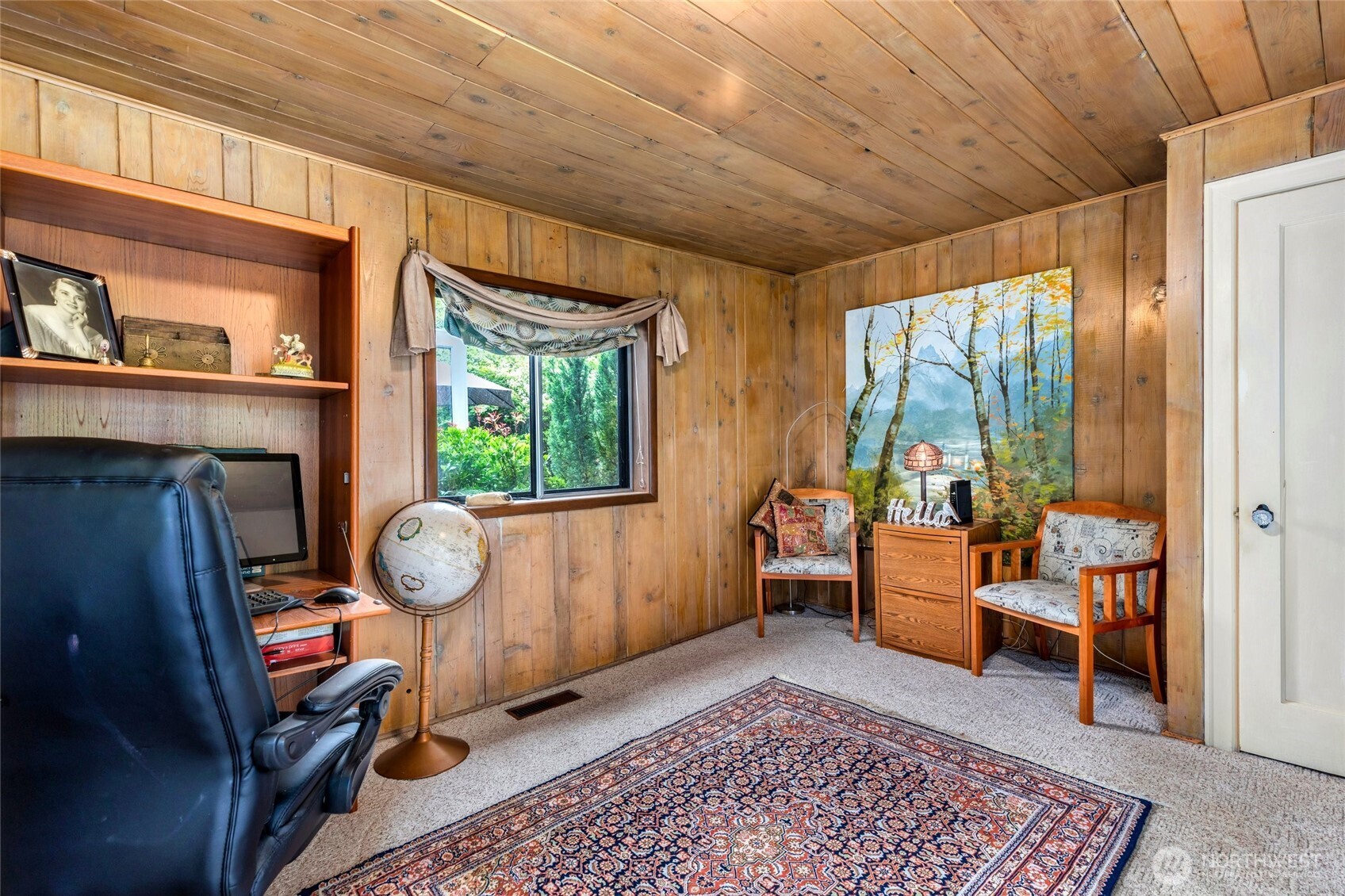 23606 Tiger Mountain Road Southeast Issaquah, WA 98027 - Photo 23 of 39 a living room with furniture and a fireplace
