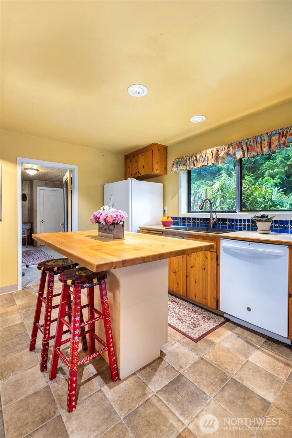 23606 Tiger Mountain Road Southeast Issaquah, WA 98027 - Photo 9 of 39 a kitchen with stainless steel appliances granite countertop a sink and cabinets