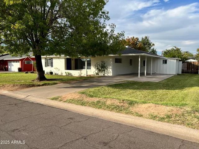 a house view with a backyard space