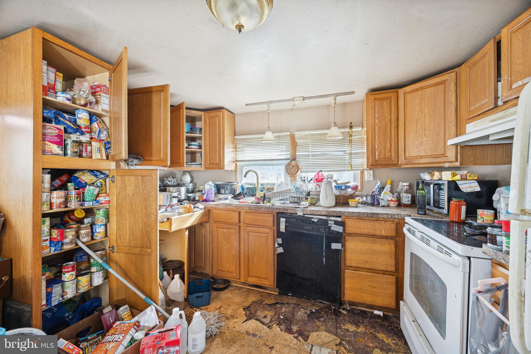 165 West Ridge Pike, Unit 215 Limerick, PA 19468 - Photo 2 of 8 a kitchen with stainless steel appliances granite countertop a refrigerator and a stove top oven