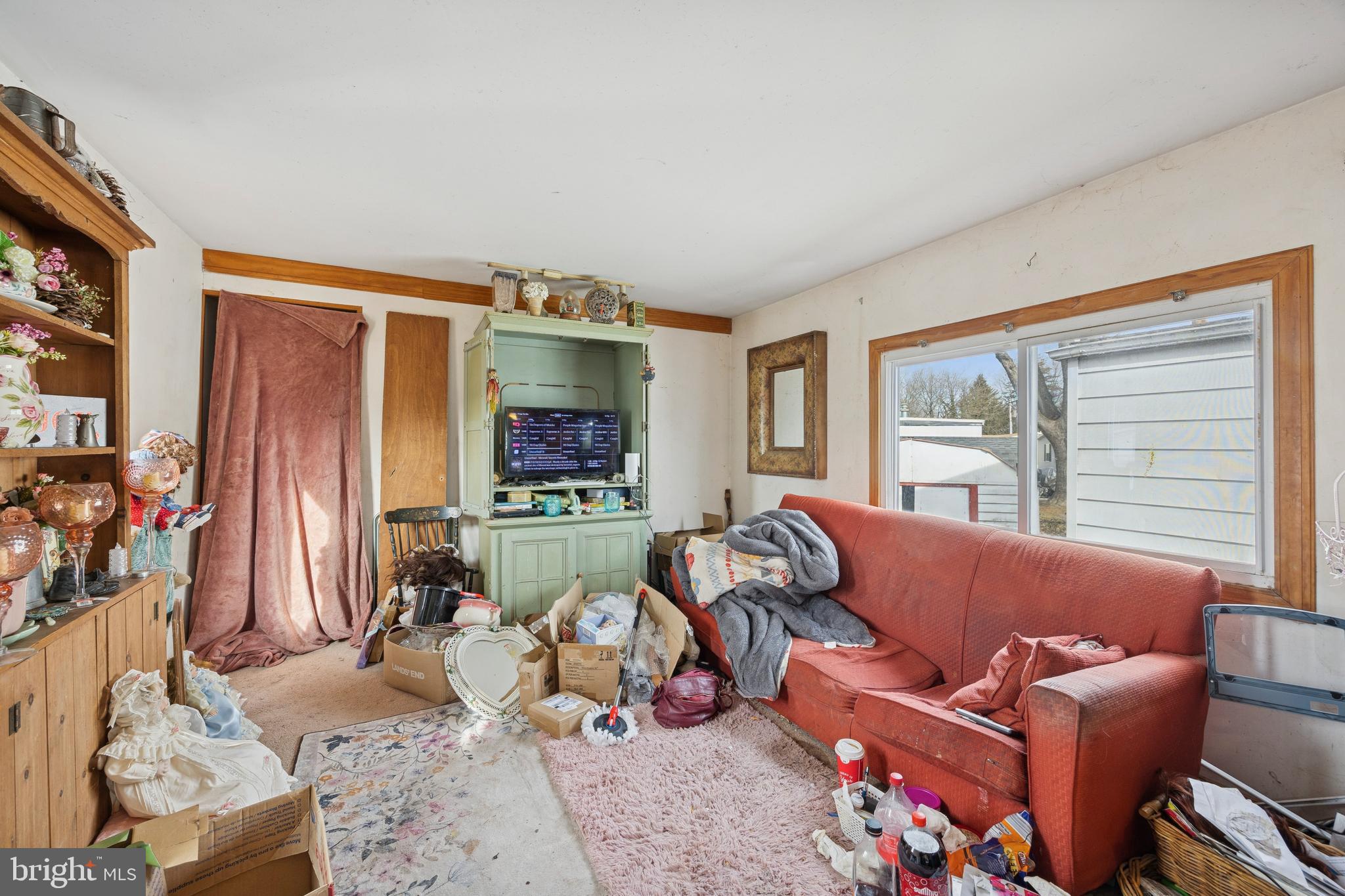 165 West Ridge Pike, Unit 215 Limerick, PA 19468 - Photo 5 of 8 a living room with furniture and a flat screen tv