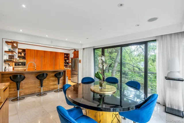 a view of a dining room with furniture window and outside view