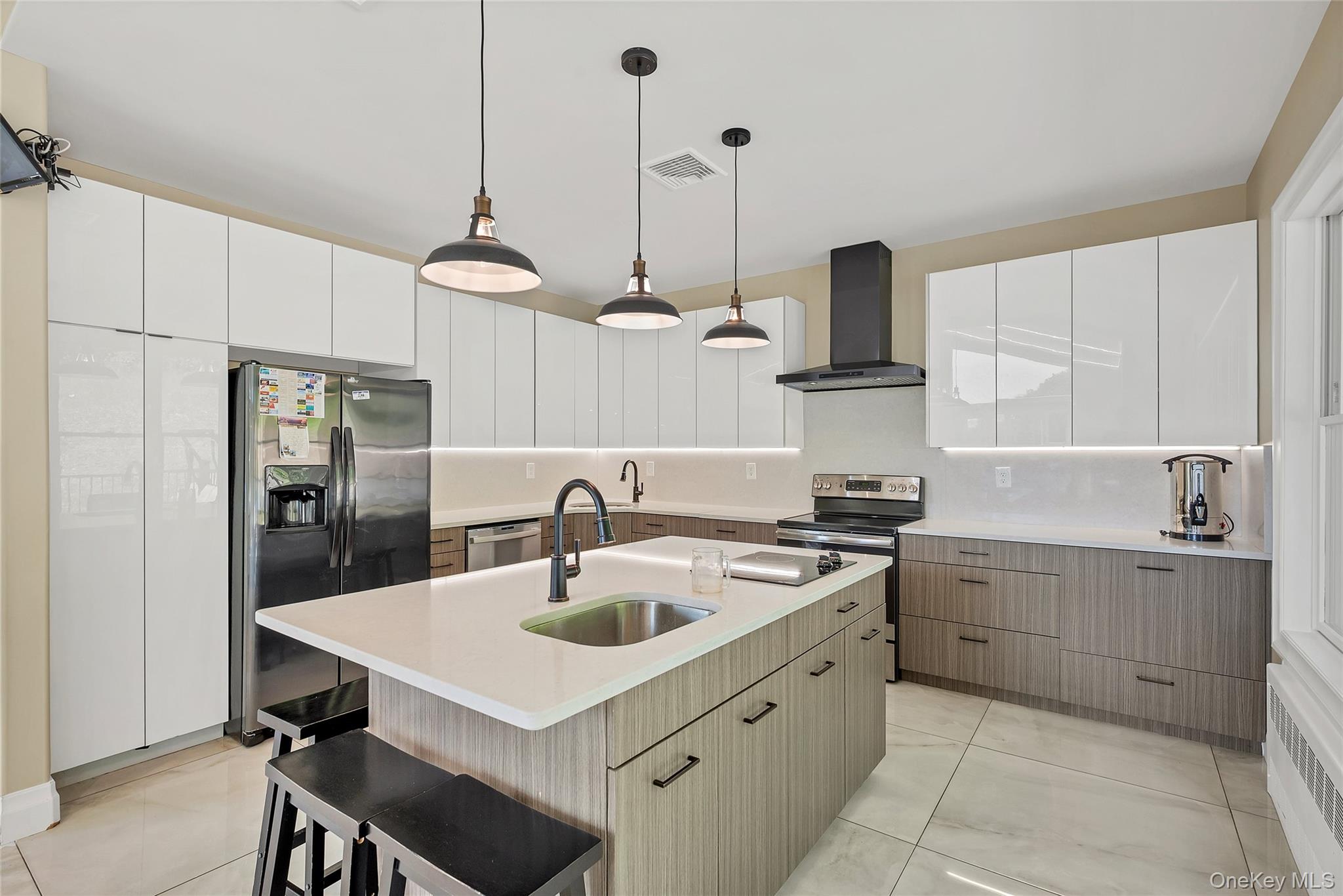 31 Walnut Ridge Lane Bloomingburg, NY 12721 - Photo 11 of 50 a kitchen with a sink a stove and chairs