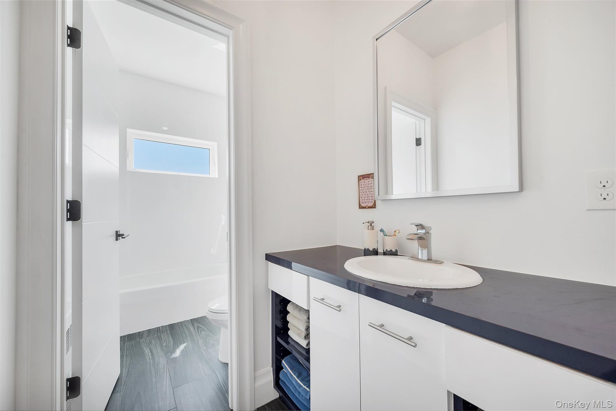 31 Walnut Ridge Lane Bloomingburg, NY 12721 - Photo 20 of 50 a bathroom with a sink and a mirror