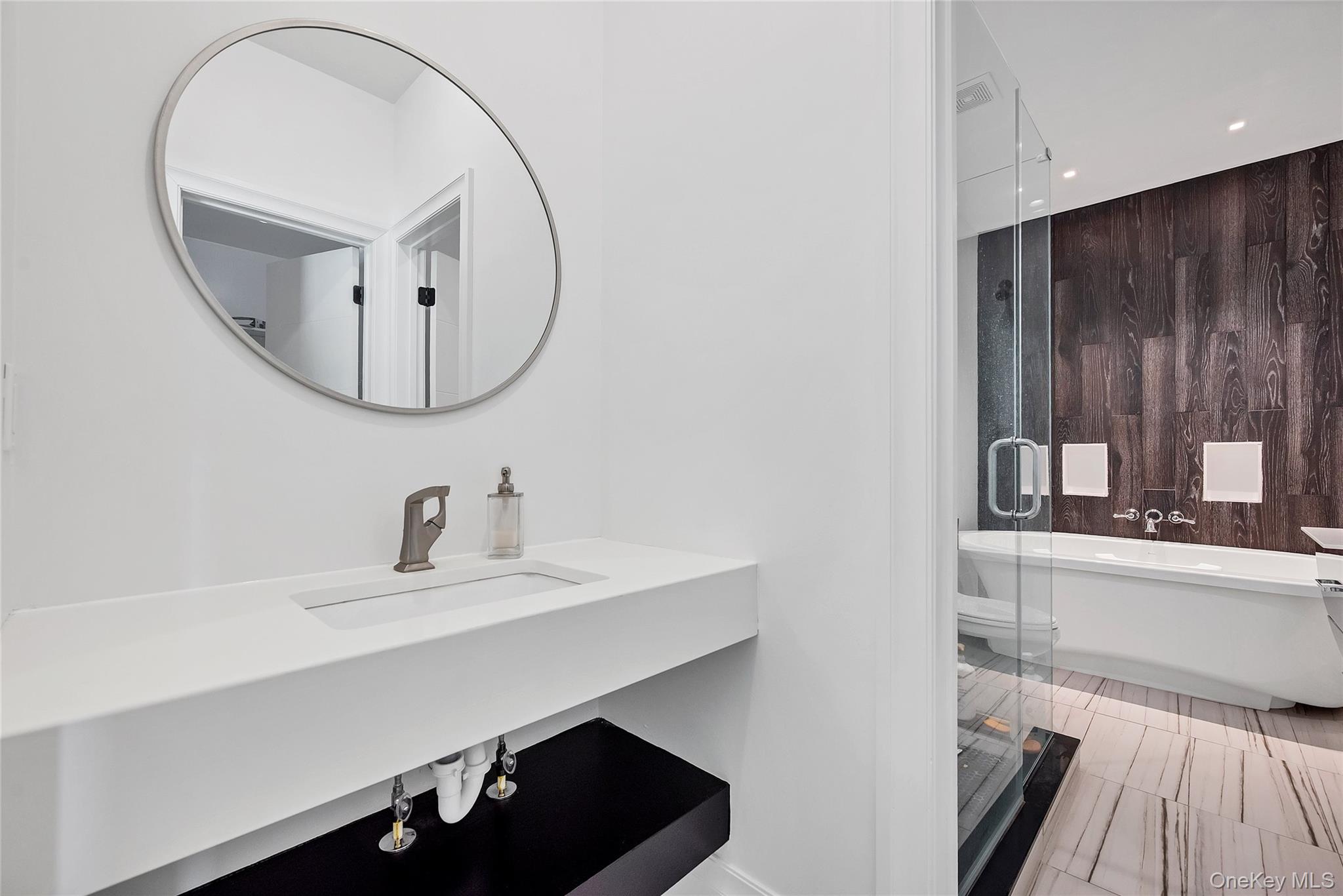 31 Walnut Ridge Lane Bloomingburg, NY 12721 - Photo 26 of 50 a bathroom with a sink a mirror and a vanity