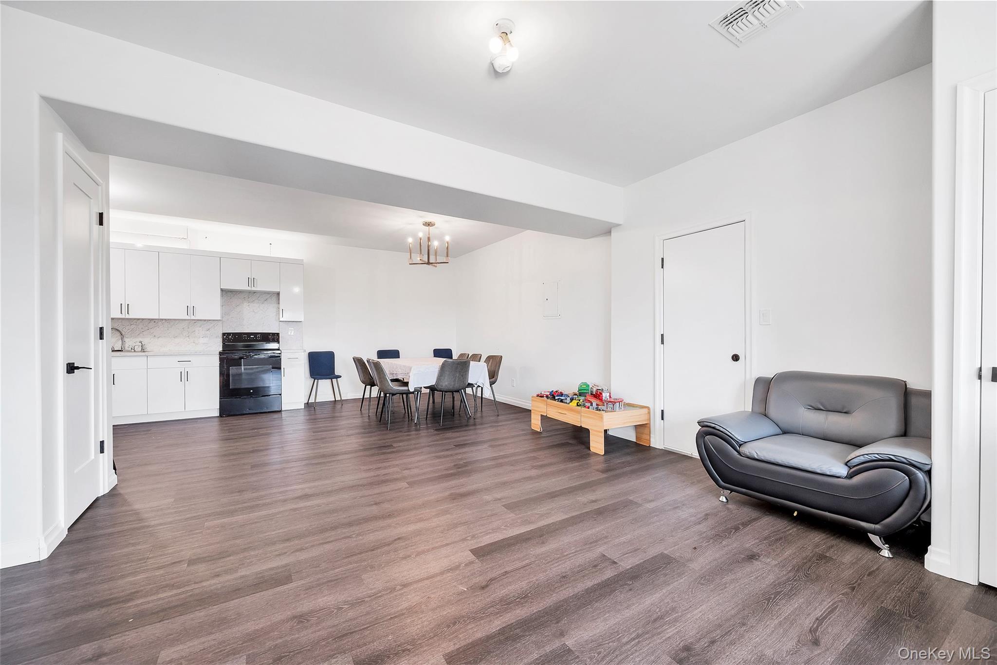 31 Walnut Ridge Lane Bloomingburg, NY 12721 - Photo 32 of 50 a living room with furniture and kitchen view