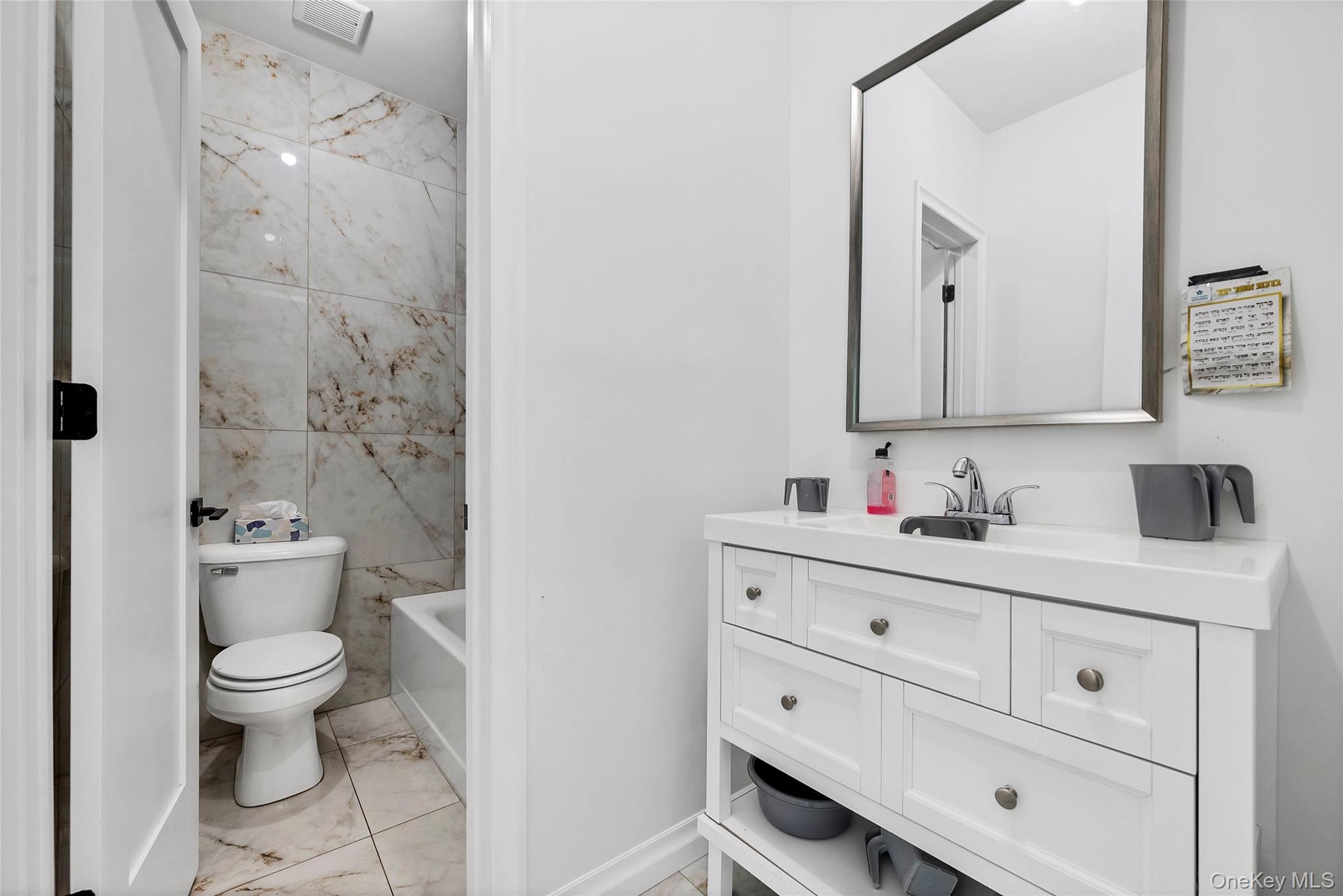 31 Walnut Ridge Lane Bloomingburg, NY 12721 - Photo 37 of 50 a bathroom with a toilet a sink a vanity and mirror