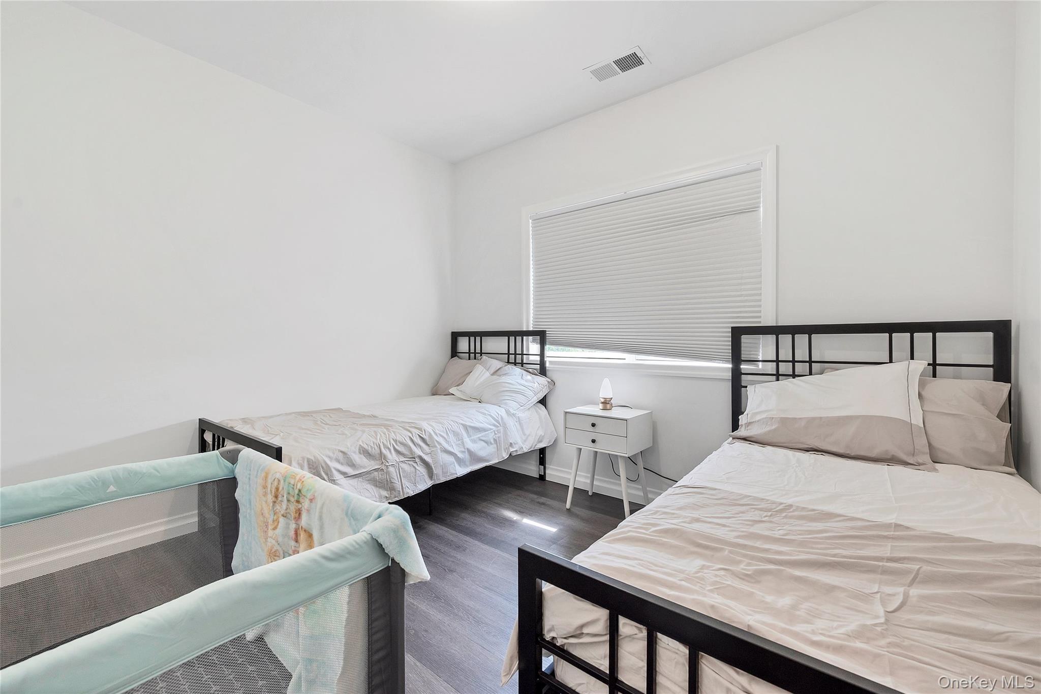 31 Walnut Ridge Lane Bloomingburg, NY 12721 - Photo 39 of 50 a bedroom with two beds and lamp