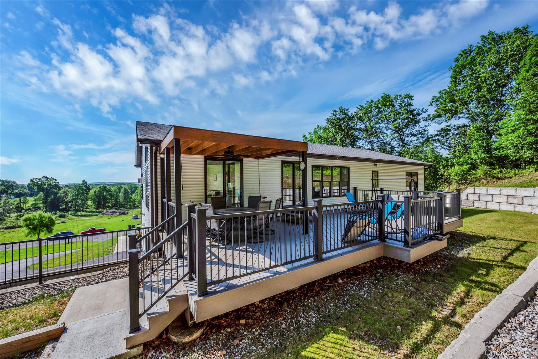 31 Walnut Ridge Lane Bloomingburg, NY 12721 - Photo 45 of 50 an outdoor view of house with swimming pool and furniture