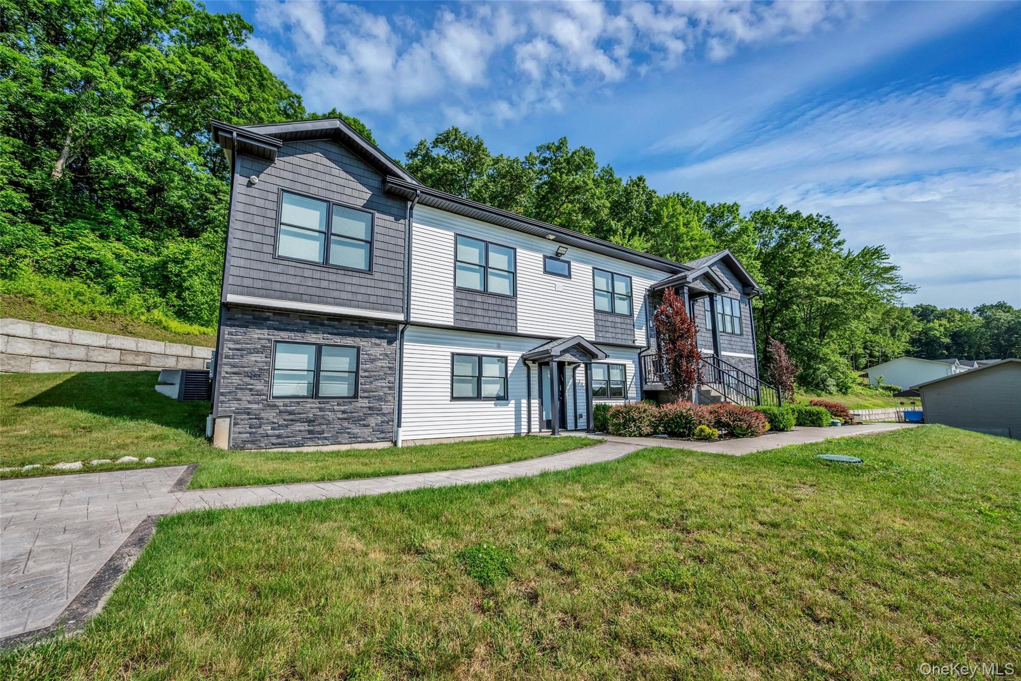 31 Walnut Ridge Lane Bloomingburg, NY 12721 - Photo 49 of 50 a view of a house with a yard and plants