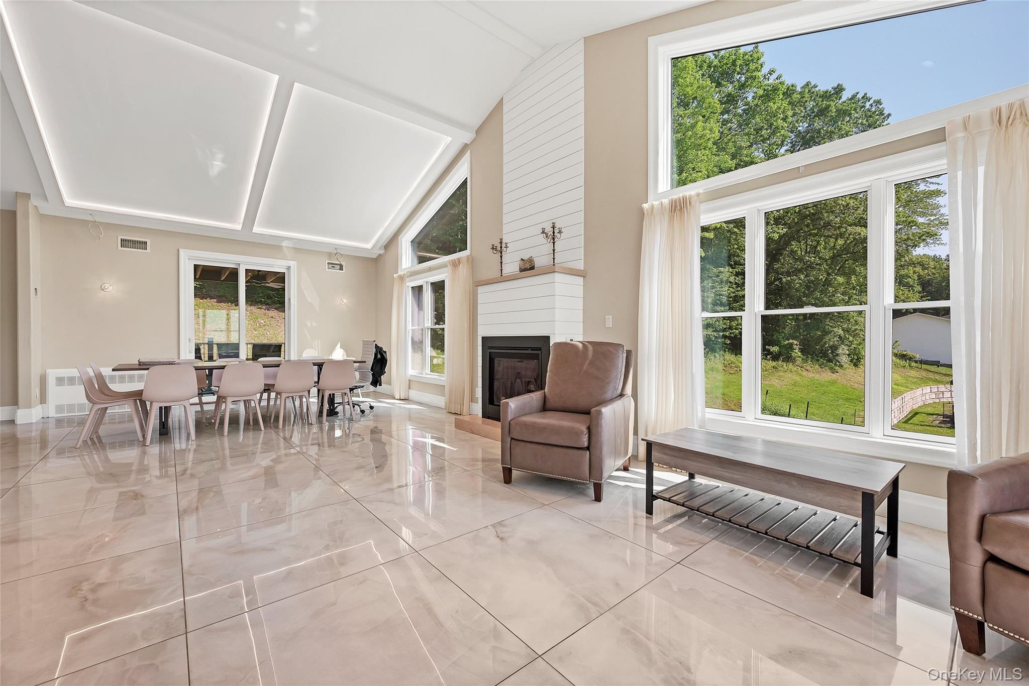 31 Walnut Ridge Lane Bloomingburg, NY 12721 - Photo 7 of 50 a living room with furniture a flat screen tv and a large window