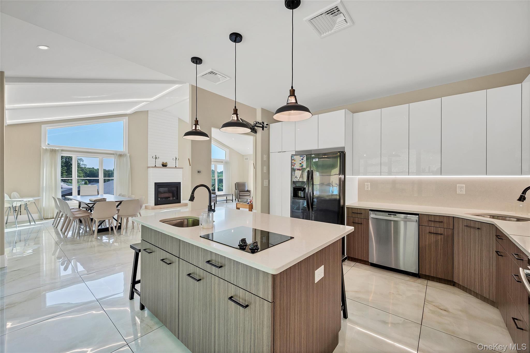 31 Walnut Ridge Lane Bloomingburg, NY 12721 - Photo 10 of 50 a kitchen with stainless steel appliances granite countertop a sink counter space cabinets and a floor to ceiling window
