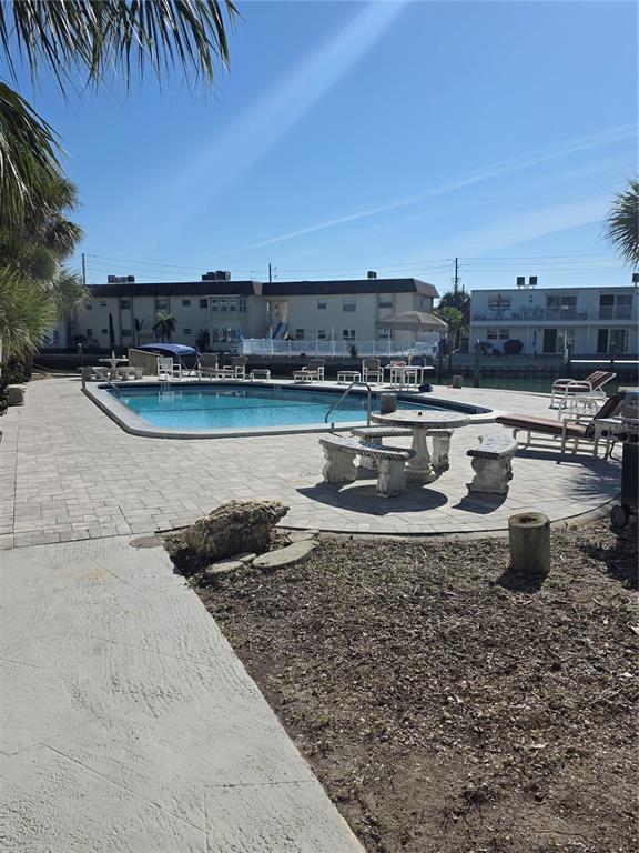 11750 Capri Circle South Treasure Island, FL 33706 - Photo 8 of 9 a view of a lake with a big yard