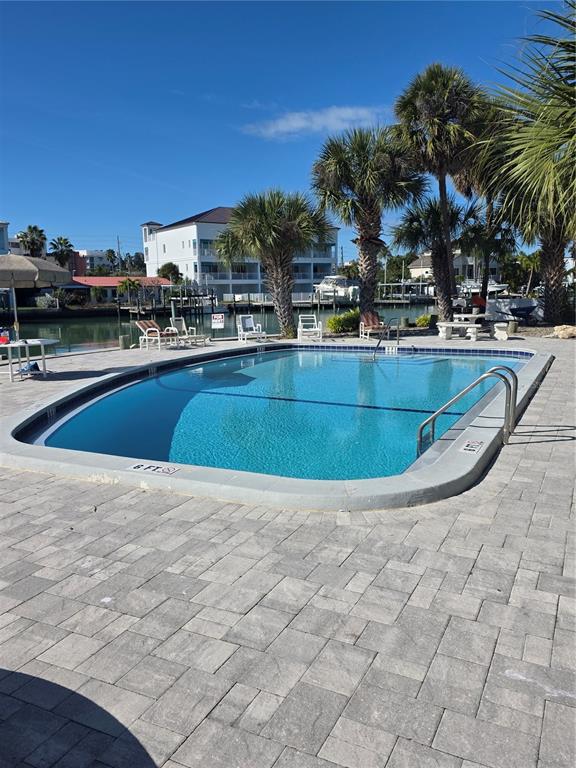 11750 Capri Circle South Treasure Island, FL 33706 - Photo 9 of 9 a view of outdoor space with swimming pool and seating
