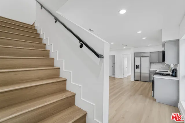 a view of kitchen with sink microwave and stove