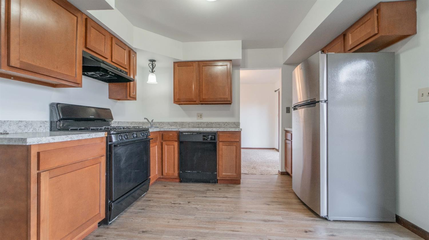 1925 Martha Street Munster, IN 46321 - Photo 5 of 23 a kitchen with stainless steel appliances granite countertop a refrigerator stove and sink