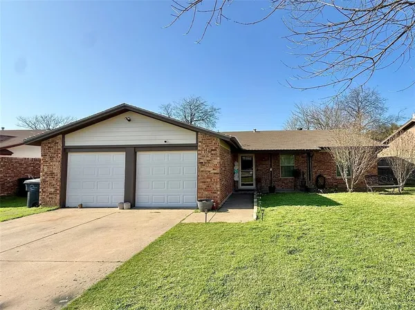 a view of a house with a yard and garage