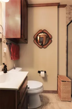 a bathroom with a sink a toilet and a mirror
